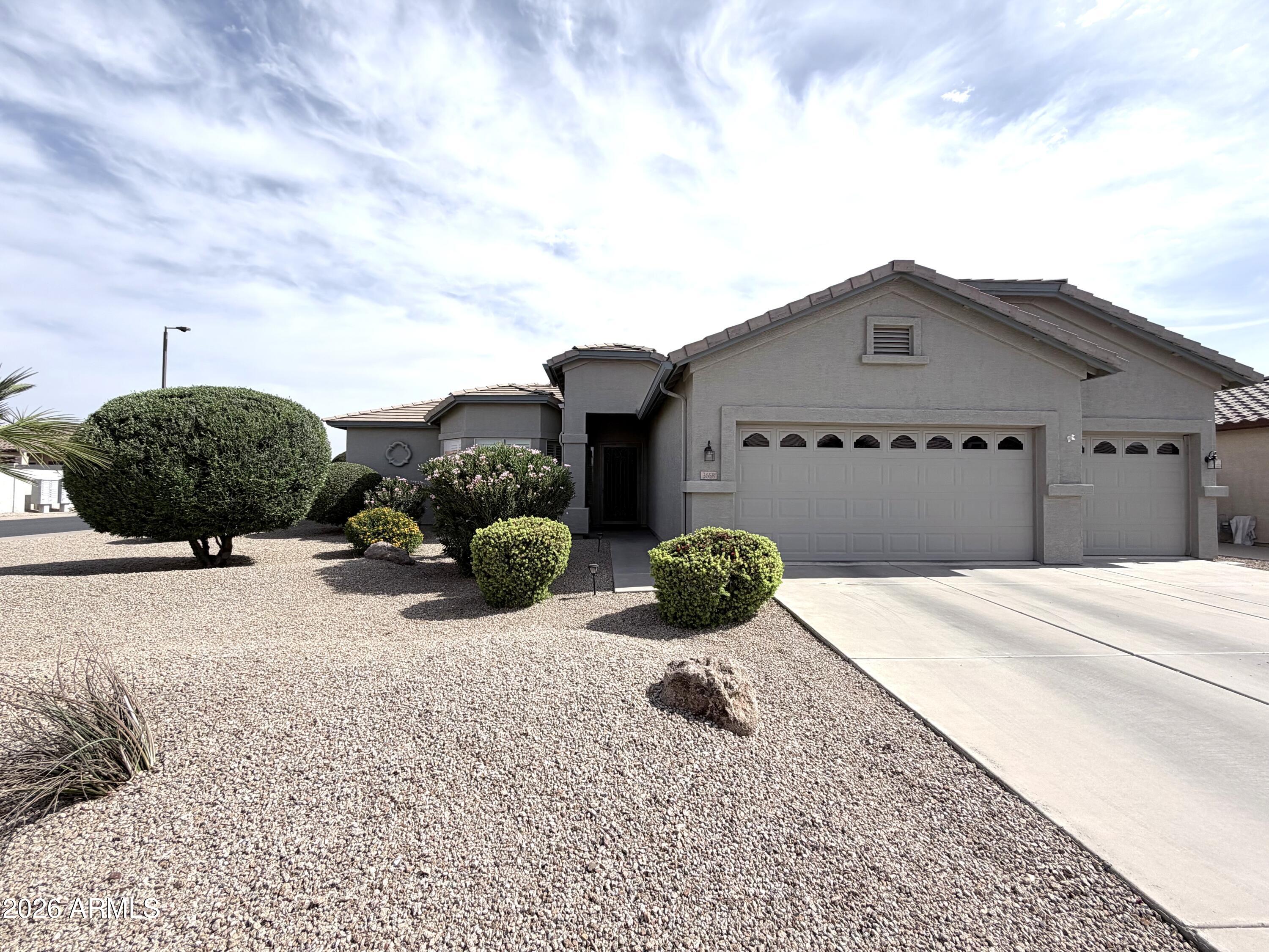 AMAZING home! Enjoy sunset views from both private front and back yards in Springfield Lakes Gated Resort Community. This unique Solera model features a 3-car garage, large family room, 3 bedrooms, 2 baths, plus a den/dining room. The spacious kitchen offers a breakfast bar, nook, cherry cabinets, granite counters, and newer appliances. Additional highlights include a full patio, low-maintenance landscaping with New drip system, front and back, Newer HVAC, Water heater, Soft water, Garage storage, and a Corner lot with only one neighbor. Residents will love access to the great recreational facilities in gated Solera.