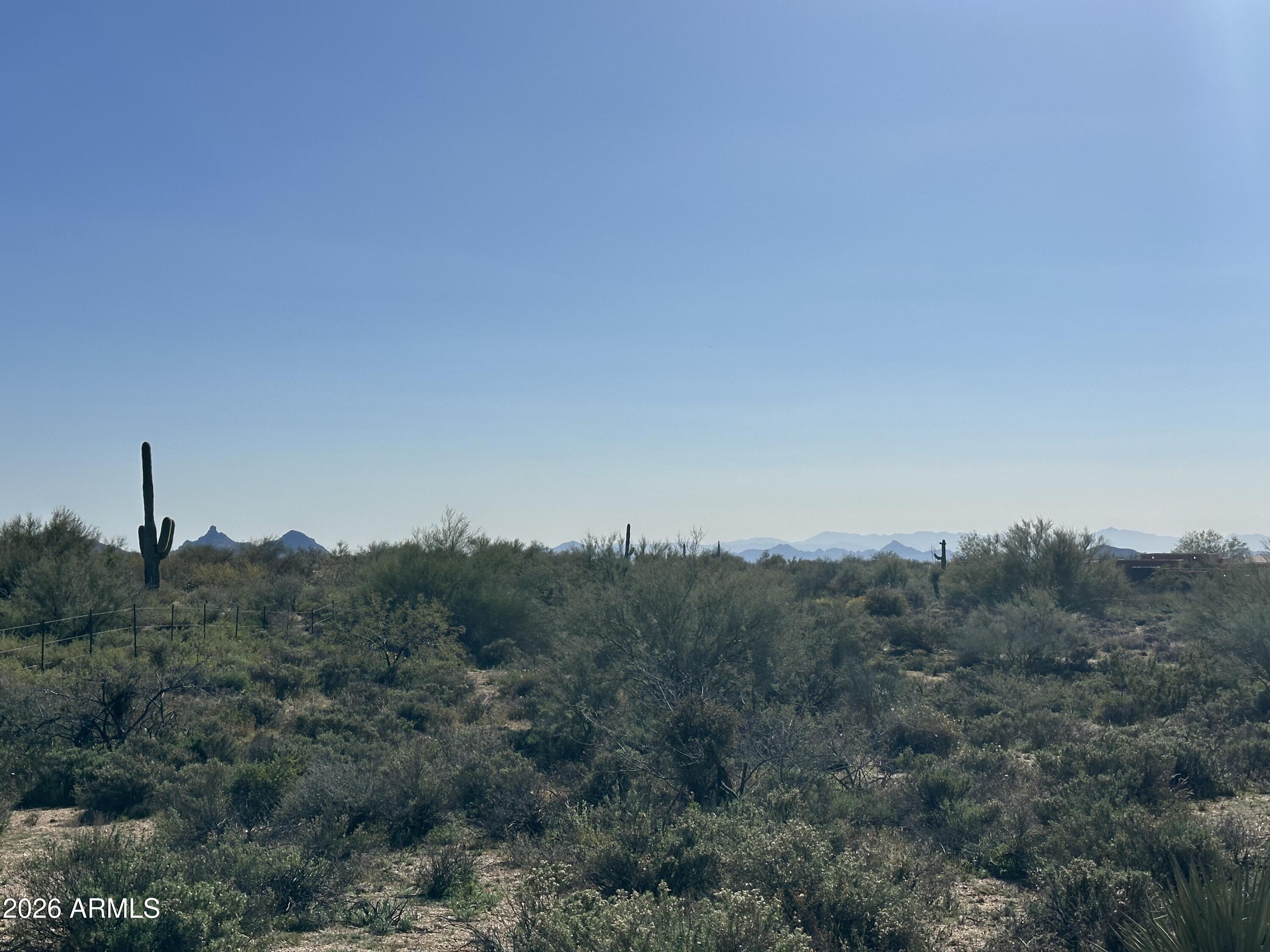 Relatively flat/easy build homesite in Desert Mountain's Village of Eagle Feather. Over an acre with a 21,476 square foot building envelope allows for design flexibility. Enjoy sunset, mountain views of Pinnacle Peak and The McDowell's, along with night lights and mountain silhouettes after the sun goes down. South facing homesite provides maximum sun exposure for outdoor entertainment areas. Owner had home plans started that may be reviewed for design ideas. Centrally located in one of Scottsdale's premier outdoor lifestyle communities! The location of Eagle Feather is close to the main gate for quick access to shopping and dining. Additional community amenities include golf, biking and hiking trails. The Sonoran Fitness Center (spa, pickle ball, tennis, swimming, fitness facilities and much more) is nearby. No membership included. Please inquire with Club regarding memberships.