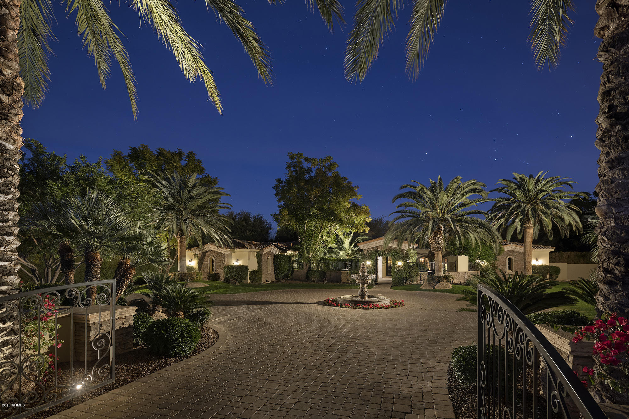 Judson at its finest. This private estate includes a spacious main house, and private guesthouse totaling 7,048 sq ft of livable space. In addition, a large 2,350 sq ft entertainment annex  includes a world class theatre and large guest casita.  This property has been completely renovated including an extensive kitchen remodel completed in 2017.  Enter a welcoming, private gated courtyard and through a custom iron door to see the recently updated quality finishes including; hand plastered walls, limestone floors, custom kitchen cabinetry and countertops.  Automated, retractable pocket doors in the great room and pool pavilion blend the indoor and outdoor living spaces. The pool complex is comprised of wading pool, large resort style pool with slide, waterfall, grotto and spa.  Expansive grass areas, old growth trees and mature landscaping provide complete privacy for friends and family.