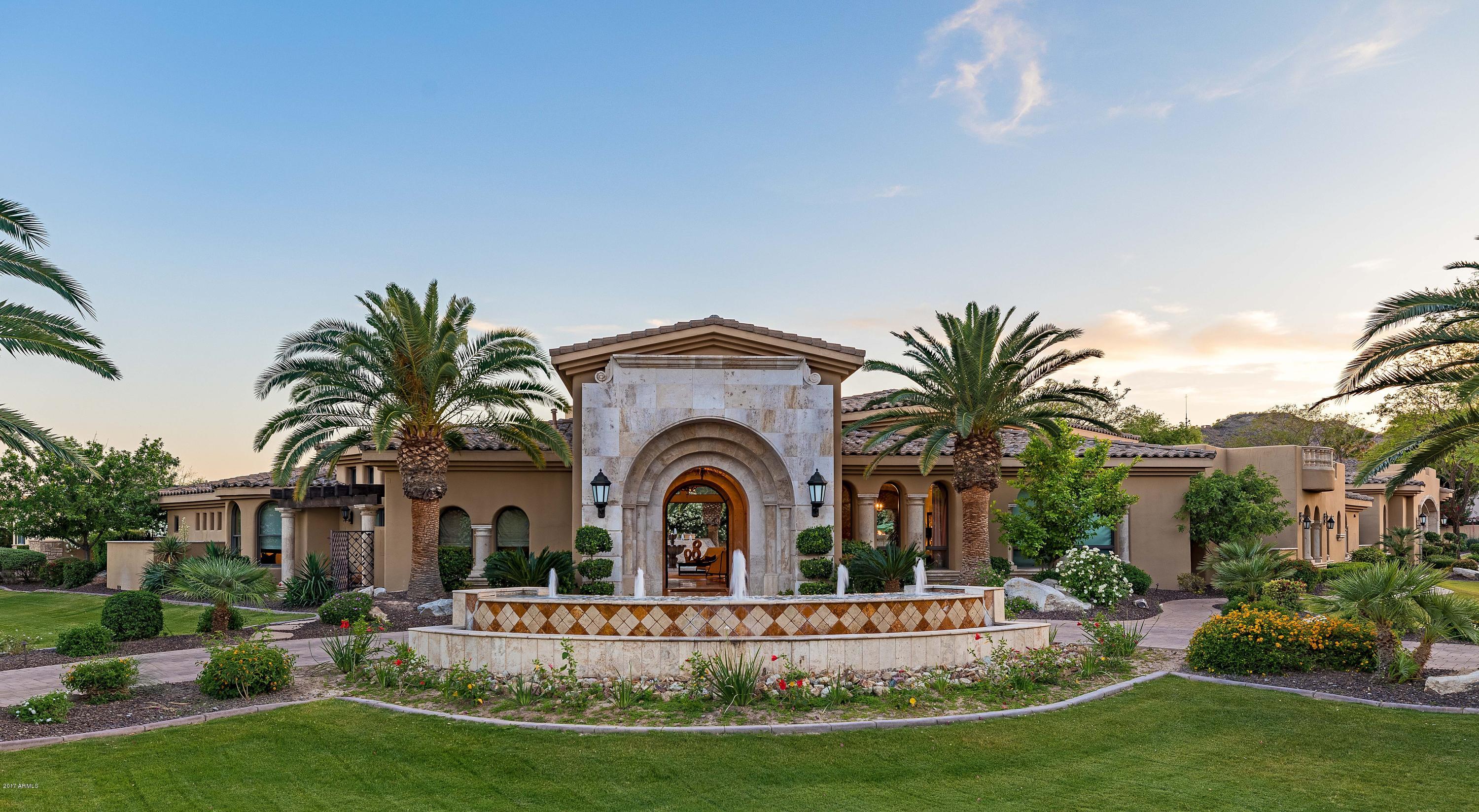 SPECTACULAR BUY.  Experience the best indoor/outdoor Paradise Valley living here; walking distance of new RITZ CARLTON.  Designed by architect Ed Chavez, this stunning estate features disappearing glass walls in all of the public rooms. Unparalleled features including Executive office with adjoining club room, Perfect family theater off great room/kitchen, Beautifully appointed 1,200sf guest house with two car garage, master bath, walk in closet and guest laundry. Total 5 air conditioned garage with room for additional three bays. Sport court, Putting Green and outstanding Resort Pool with water and gas features.  SEE WHY THIS HOME IS SO SPECIAL, under Photo Tab open its ''MOTION VIDEO'' and its Floor Plan under Document Tab Please.
