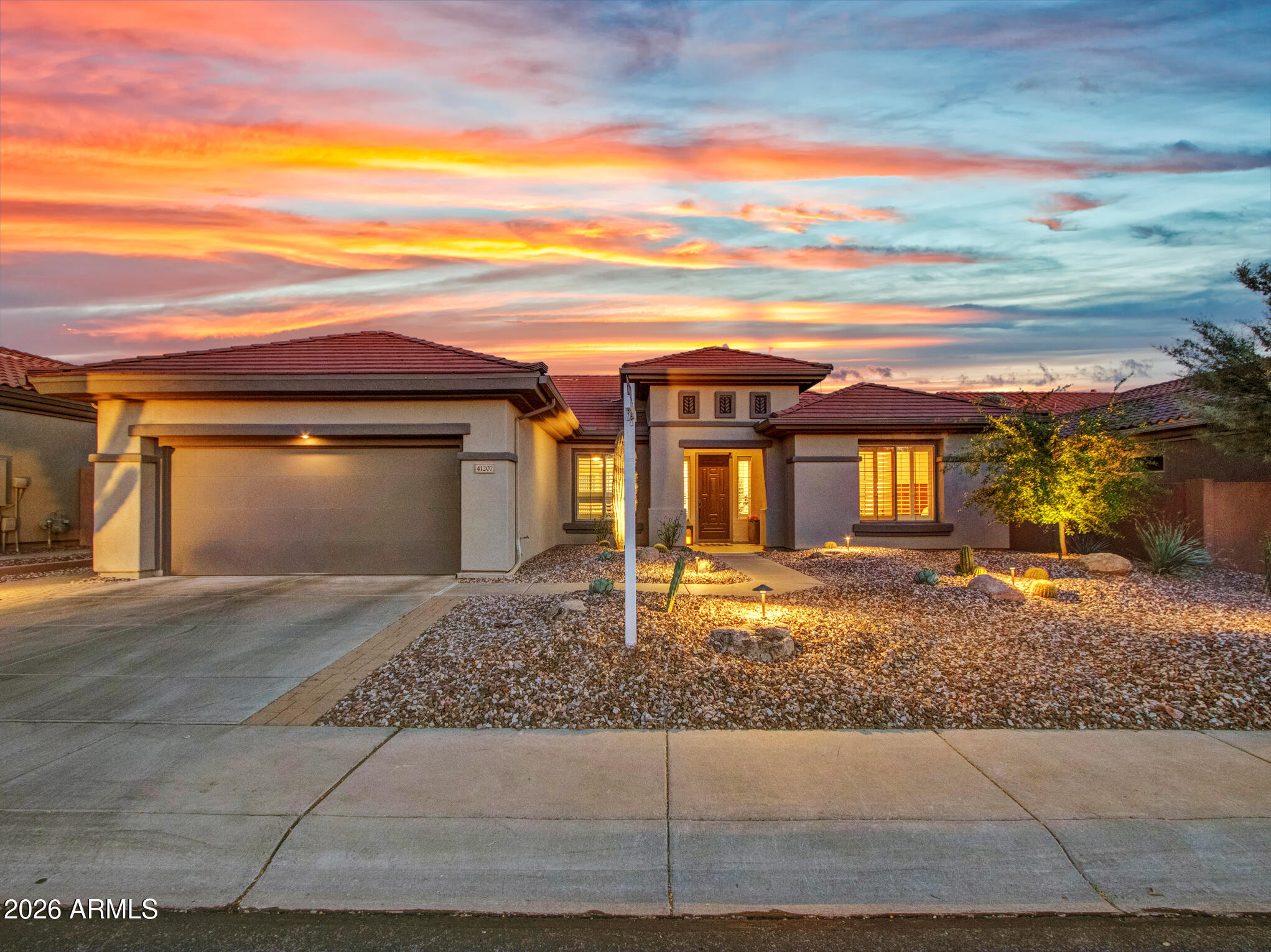 Located on a private oversized cul-de-sac lot in the guard-gated Anthem Country Club, this beautifully updated Peregrine model offers style, space, and extensive recent improvements. With over $90,000 in upgrades, the home features a bright open layout, soaring 10-foot ceilings, and a desirable split-bedroom floor plan designed for both comfort and function.

The kitchen opens seamlessly to the main living area, creating an ideal setting for everyday living and entertaining. Highlights include granite countertops, stainless steel appliances, abundant cabinetry, pantry storage, a large seating island, and new pendant lighting that adds a fresh designer touch. The living room has been further enhanced with new recessed can lighting.
MORE The spacious primary suite offers direct patio access and a well-appointed bath with dual sinks, a large vanity, soaking tub, separate toilet room, and walk-in closet. Secondary bedrooms are generously sized. Plantation shutters, new wood-look tile flooring, upgraded bedroom carpet, fresh interior and exterior paint, a new water heater, Nest thermostat, and additional sealing work all contribute to the home's move-in-ready appeal.

Step outside to enjoy a quiet, private backyard with no homes directly behind, mountain views, and open desert skies. Recent exterior improvements include low-maintenance landscaping, artificial turf, a new drip system, firepit and a covered patio with a newly installed misting system for added outdoor comfort, as well as new large ~27 foot patio power shade which adds modern convenience and increased outdoor and indoor living comfort. The Patio also includes new pavers and a pre-wired TV outlet and mounting bracket.

The extended-length garage includes extra space for storage or a work area, plus a NEMA 14-50 outlet for EV charging. This is an exceptional opportunity to enjoy the Anthem Country Club lifestyle with access to golf, clubhouses, fitness centers, pools, walking paths, and more.