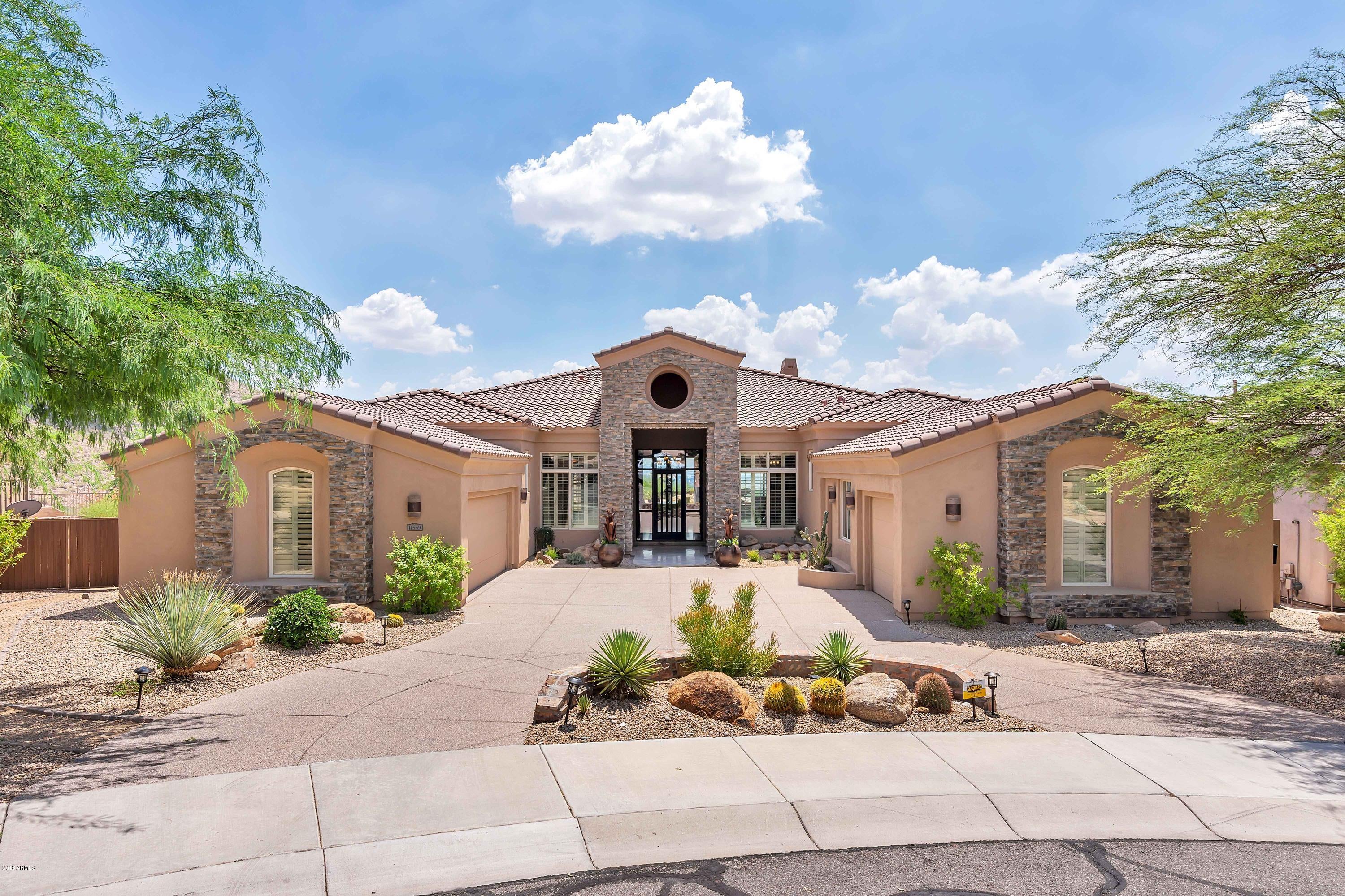 STUNNING VIEW PROPERTY!  Located at the top of the hill, this home showcases Expansive Views from nearly every window.  Enter into the Formal Living & Dining Room featuring beautiful Picture Windows, Travertine Floors, Stone Accented Columns & Charming Fireplace.  Entertain in the Newly Remodeled Kitchen w/Stainless Steel Appliances & Quartz Counters.  The Kitchen is open to the Family Room & offers a custom Entertainment Center, Fireplace & Shutters.  Split layout offers a Luxurious Master Suite w/ Expansive Shower, Jetted Tub & Granite Counters.  There are 3 additional bedrooms, an Office + a Guest Suite w/interior & exterior access.  Double Lot provides 2 different view experiences.  Admire City Views relaxing in the Pool & Spa or Mountain Views playing on the putting green & grass.