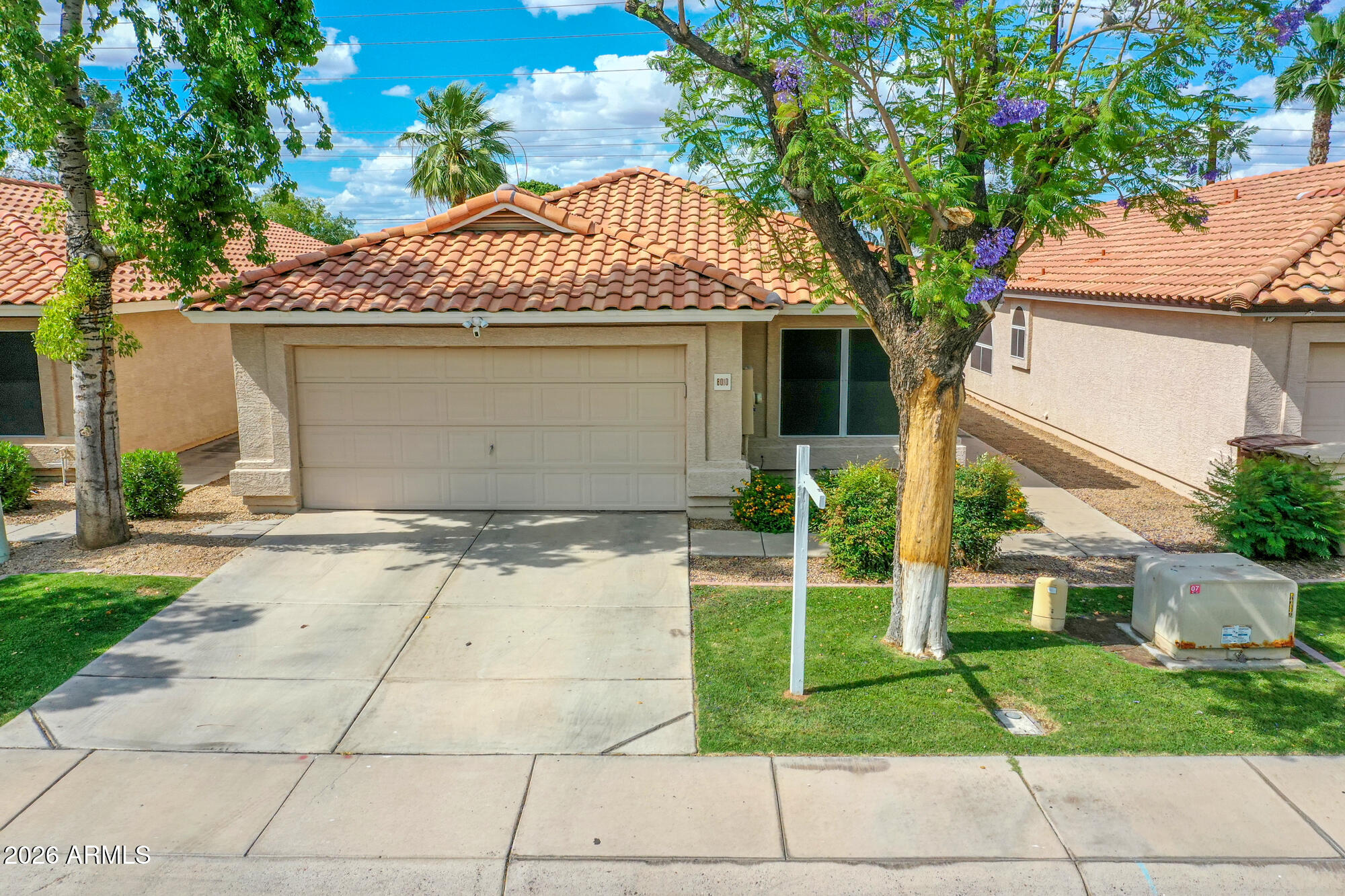 Welcome to this beautifully upgraded Peoria home where comfort meets elevated design. Vaulted ceilings create a light, open feel, complemented by granite surfaces throughout the kitchen and baths. The kitchen offers a thoughtful layout with a lazy Susan for added function. Recent updates include a new water heater and microwave. French doors open to a private, finished backyard designed for low-maintenance living and effortless entertaining. Enjoy ideal north/south exposure, highly desirable in Arizona. Additional features include dual pane windows, an electric garage door, a custom shiplap accent, and two storage closets. Community pool and prime location near parks, shopping, dining, and easy airport access.