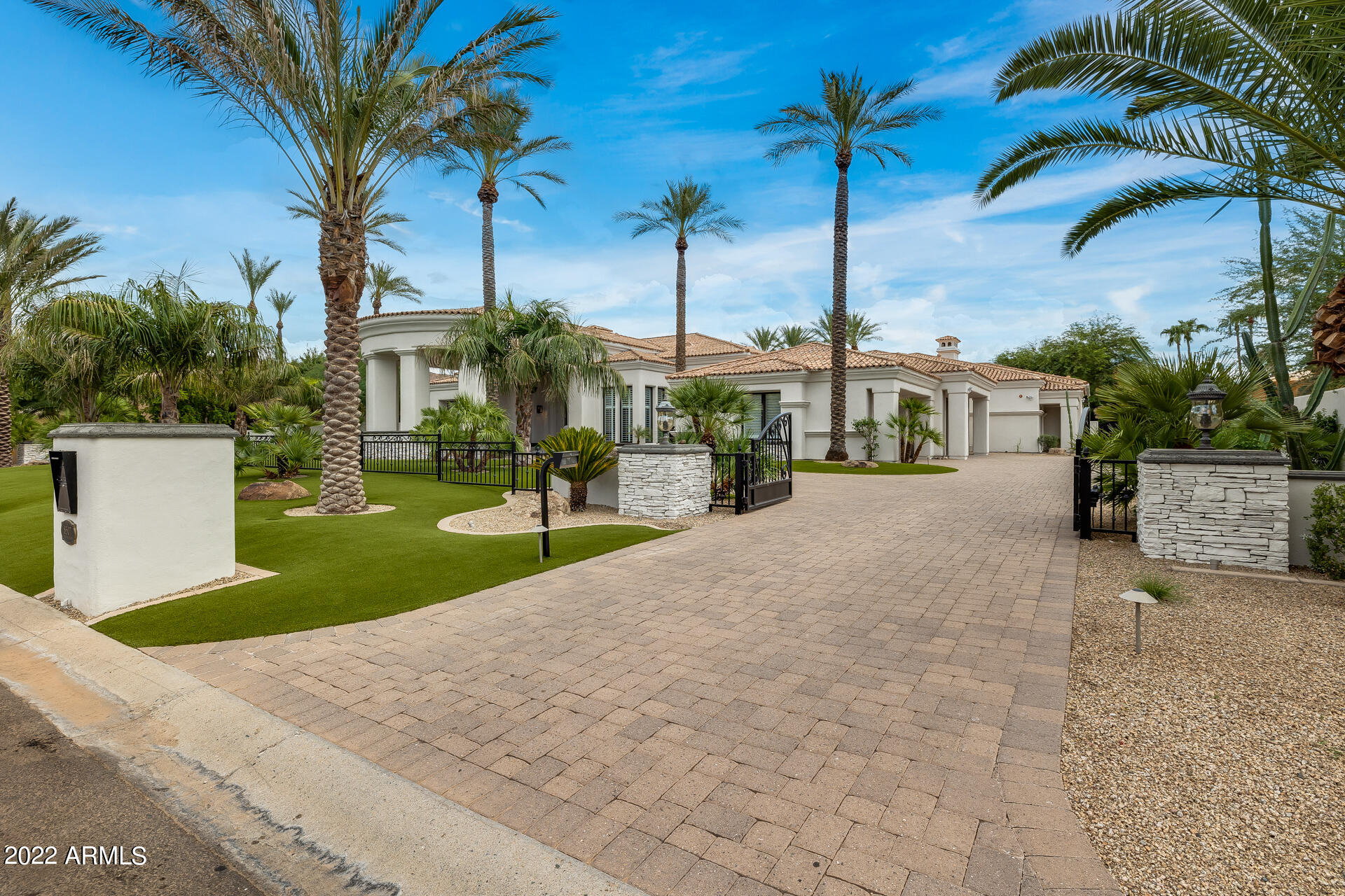 This gorgeous SoHome remodeled privately gated estate has it all! 5 Bedrooms plus den, 7 bathrooms, entertainment wet bar, 14' tall pocket door wall of glass, wine cellar 4 car garage with huge storage room and an amazing backyard! The circular drive takes you to a stunning entrance with large Portico. Every detail has been carefully thought out, and the home is welcoming and warm even though it's over 7,200 Sq. Ft. Hand carved details, wood plank floors, wood shutters, smooth coat interior walls and multiple fireplaces are just a few of the details of this home. The primary bedroom and bathroom boasts a fireplace, unbelievable closet, sitting room with a butler wet bar. All bedrooms are ensuites and there are 2 guest half bathrooms. Owner/Agent will consider trades. The kitchen features two islands and has all the amenities one expects at this level of luxury home. Laundry room has hook-ups for two sets of washers & dryers, a wet sink and tons of storage. The backyard has been completed with anything and everything necessary for entertaining family and friends.