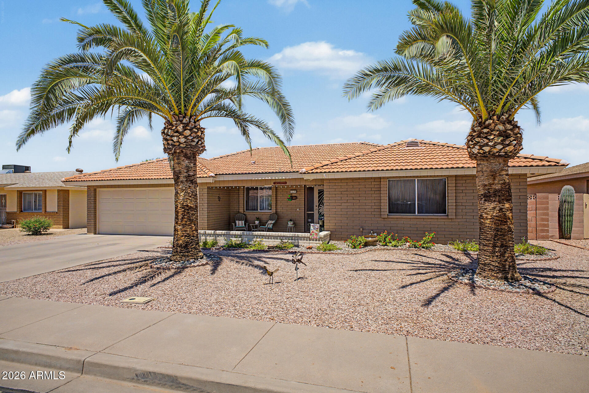 Experience true pride of ownership in this meticulously maintained & custom-built 3-bed, 2-bath residence. Located in Sunland Village East, one of the East Valley's most desirable 55+ communities! Offered move-in ready w/a desirable split floorplan, this home provides immediate peace of mind w/a suite of recent ''big-ticket'' improvements including a newer roof (2022), high-efficiency A/C (2025), newer water heater (2020), exterior paint, extra attic & patio roof insulation, 8 ft block wall heightened for privacy, & side golf gate for parking the golf cart. The updated kitchen is a chef's delight, boasting elegant cappuccino-finished cabinetry, upgraded countertops, & modern recessed dimmer lighting that replaces the original light box. The seamless flow leads into a cozy living room & an expansive extended family room, where large south-facing windows bathe the space in natural light. Enjoy a carpet-free interior w/ durable, easy-to-clean 18" tile throughout.

The generous primary suite is tucked away for maximum privacy, featuring north-facing windows, a spacious walk-in closet, and an ensuite bath w/ extended vanity area & custom-tiled shower/tub combo. 

Two oversized guest bedrooms offer exceptional storage- one w/ dual closets & the second w/ its own walk-in. They share a beautifully updated bathroom featuring a floor-to-ceiling tiled walk-in shower.

Step outside to your north-facing backyard, designed for ultimate Arizona relaxation. The partially screened-in patio is the perfect "outdoor living room" for entertaining. Your furry friends will love the fully fenced yard, complete with a dedicated dog run & a newer extended height 8 ft block gate (originally 4 ft).

The oversized laundry room is a workspace of its own, equipped w/ a utility sink, extra cabinetry, & 2020 appliances (washer & dryer) that all convey. Storage is abundant throughout, from the hallway closets to the deep cabinetry in the double garage. The garage also features a dedicated mechanical room for the water heater.

This is a rare opportunity to own a turn-key, updated custom home that has been loved & maintained by only 2 owners since day one. At Sunland Village East, you'll have access to top-tier amenities- golf, pickleball, tennis, bocce ball, shuffleboard, pools, clubs, fitness center, & a vibrant social calendar. Come & see this one before it's gone!