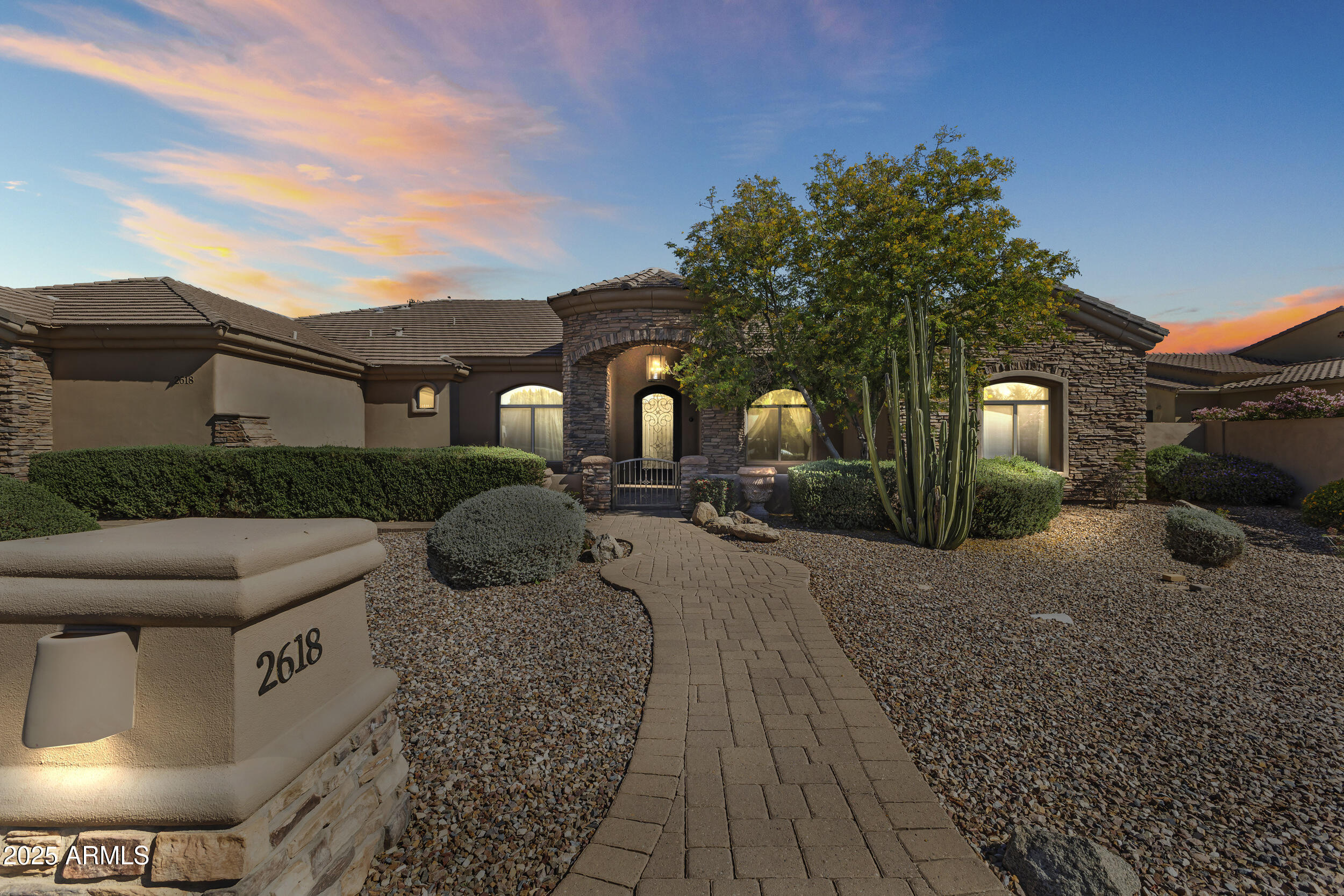 MOTIVATED SELLER. 
Spectacular custom home situated within the gated community of Whitewing at Krueger.
A beautiful wrought iron door welcomes you into a foyer with a panoramic glass wall and a grand view of the backyard. 
The backyard has a large covered patio, a beautiful water feature, additionally, there is a large gazebo with BBQ. The backyard is pool and spa-ready with pre-wired electric and an exterior pool bath. The large master suite features a separate exit to the backyard. Huge built walk in closet, and a luxurious master bath with Jet Jacuzzi, multiple shower heads, snail shower. All bedrooms have their own bath and walk in closets. There is also a home office with its own exit to the front courtyard and a home theater room. Home theater room is pre-wired for projection and sound. Gourmet kitchen with top of the line appliances - sub zero fridge, Dacor range/over and dishwasher, granite and custom cabinetry. The oversized garage has epoxy flooring and cabinetry. Located approx. 2 miles from 202 SanTan Freeway, and within walking distance to nearby shopping and dining.