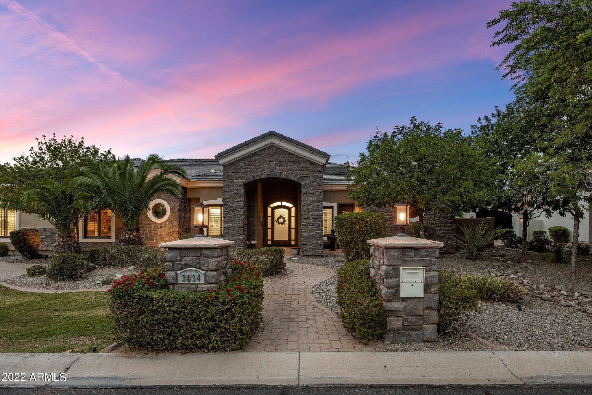 Amazing custom home on a 1/2-acre lot. Located in the gated community of Whitewing at Higley. This single level home boosts beautiful curb appeal with a paver entrance as well as a half circle driveway. Foyers opens to a wonderful open floor plan & beautiful view of the lush backyard. Walk in the front door to a formal dining room with stone features. Highly upgraded kitchen with custom cabinets, Stainless steel appliances and built-in fridge. Oversized island for hosting gathering. Walk in pantry. Family room has large bright windows & custom cabinets. Travertine flooring and carpet in the right places. The master retreat has a separate tub and shower & walk in closet. Jack and Jill bathroom for other two bedrooms as well as a full bathroom in the other bedroom. Extended garage & storage RV gate. Backyard is stunning with shade trees, pool with waterslide and a rock water feature. Basketball is your game you say. Grab a ball and play some hoops on your very own court. Reach out now for a private tour of this luxury home.