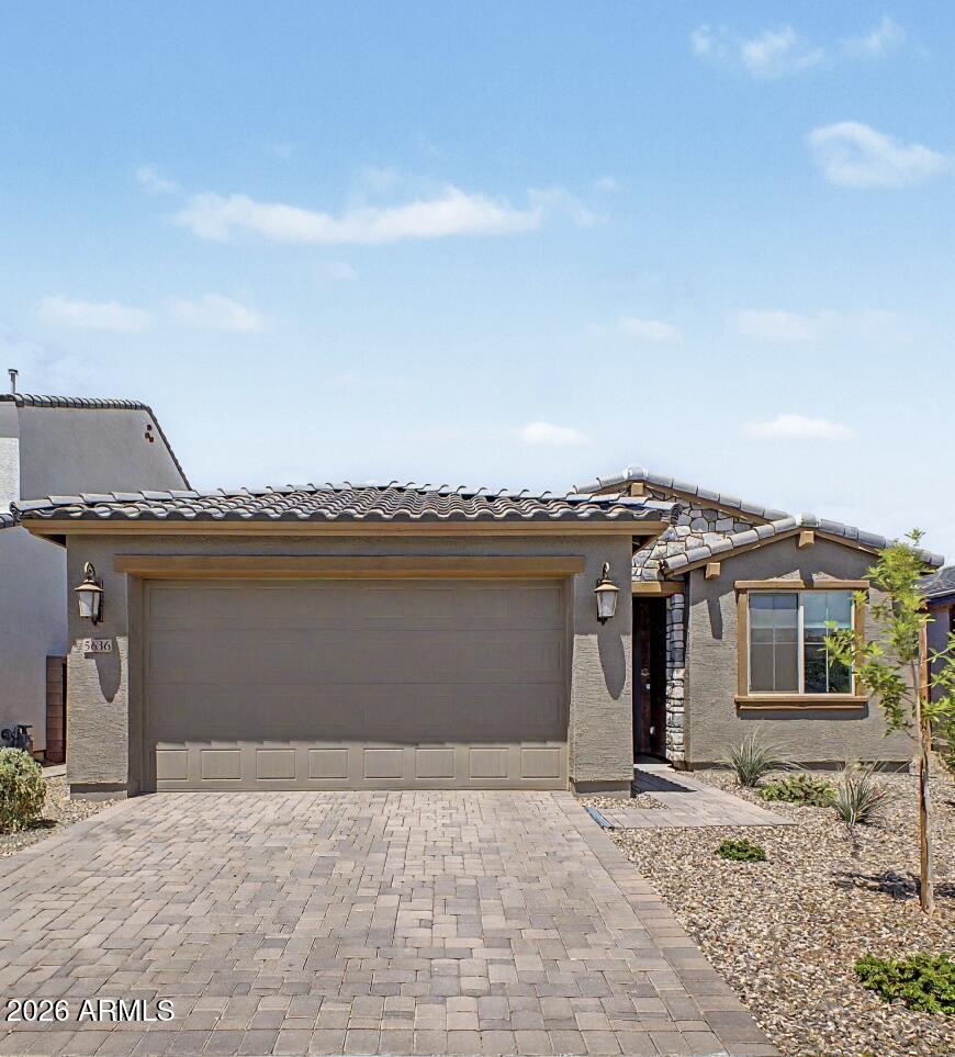 Better than waiting for new construction -this Taylor Morrison home is move-in ready now! Built in 2024 in the desirable Tierra Montana subdivision, this beautifully maintained 4-bed, 2-bath home offers 1,755 sq. ft. of modern living with stylish finishes throughout. Enjoy an open-concept layout with tile flooring, recessed lighting, neutral tones, and a spacious great room. The kitchen features quartz countertops, stainless steel appliances, gas range, ample cabinetry, and great flow for entertaining. The primary suite offers a relaxing retreat with dual sinks, spacious closet, and upgraded super shower. Complete with stone accents, paver driveway/walkway, desert landscaping, and a clean, barely-lived-in feel--this one is ready to impress!