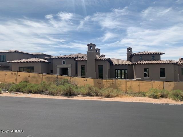 Brand new spec. home nearing completion located on a stunning south facing golf course lot with views of the golf course, Pinnacle Peak and the McDowell Mountains. This Mediterranean modern farmhouse has a giant set of automated pocket doors that allows the great room and large back patio to blend seamlessly together. Extensive use of hand painted tiles and custom cabinetry throughout. A modern glass wine room is right off the formal dining room. The master bedroom has built-in cabinetry and floating shelves on either side of the fireplace. Master bath has full separate his and her bathrooms connected by the shower in the middle and both have brick groin 16' high ceilings with custom light fixtures. A large bonus room is upstairs with a bedroom. The home will be complete by the end of May.