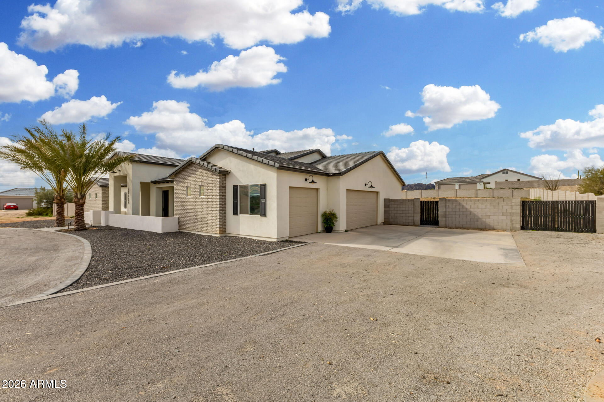 No HOA! Pride of ownership shines in this 4-bedroom home situated on a HUGE 1.20-acre lot! 3-car garage, RV gate, and a circular driveway. Meticulously designed interior with clean lines promotes a modern feel. Impressive open floor plan is filled with abundant natural light and features wood-look tile flooring, neutral tone, and abundant natural light throughout. Gourmet kitchen is a cook's delight! High-end stainless steel appliances, quartz counters, crisp white cabinets adorned with crown moulding, a walk-in pantry, recessed/pendant lighting, and a prep island with a breakfast bar complete the picture. Romantic main retreat with two vanities, a make-up desk, garden tub, and walk-in closet. Fully fenced CMU block property wall a $70K cost.  Something others builders are not including. Sizable den provides flexible use as a reading nook, gym, or office. Don't miss the oversized backyard, which includes a covered patio. Act now before it's gone!