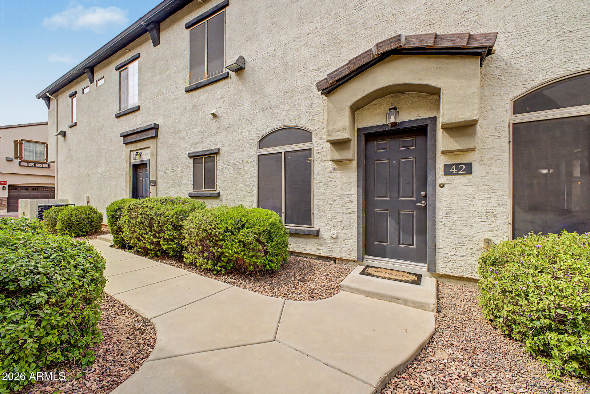 Enjoy comfortable living in this charming two-story townhome nestled in the sought-after GATED Tre Allagio Community! From the moment you enter, the inviting living room sets the tone for a warm and welcoming atmosphere. Wood-look tile flooring, neutral paint, ceiling fans, and tons of natural light enrich the overall appeal. The kitchen provides track lighting, built-in appliances, a center island with a breakfast bar, and abundant cabinets for extra storage. A powder room completes the main level. Upstairs, you'll find sizable,  bedrooms, each with its own walk-in closet and private bathroom, offering comfort and privacy for all. Continue to the backyard, which includes a covered patio and putting green. PLUS! Excellent Community amenities await. Don't miss this amazing opportunity!