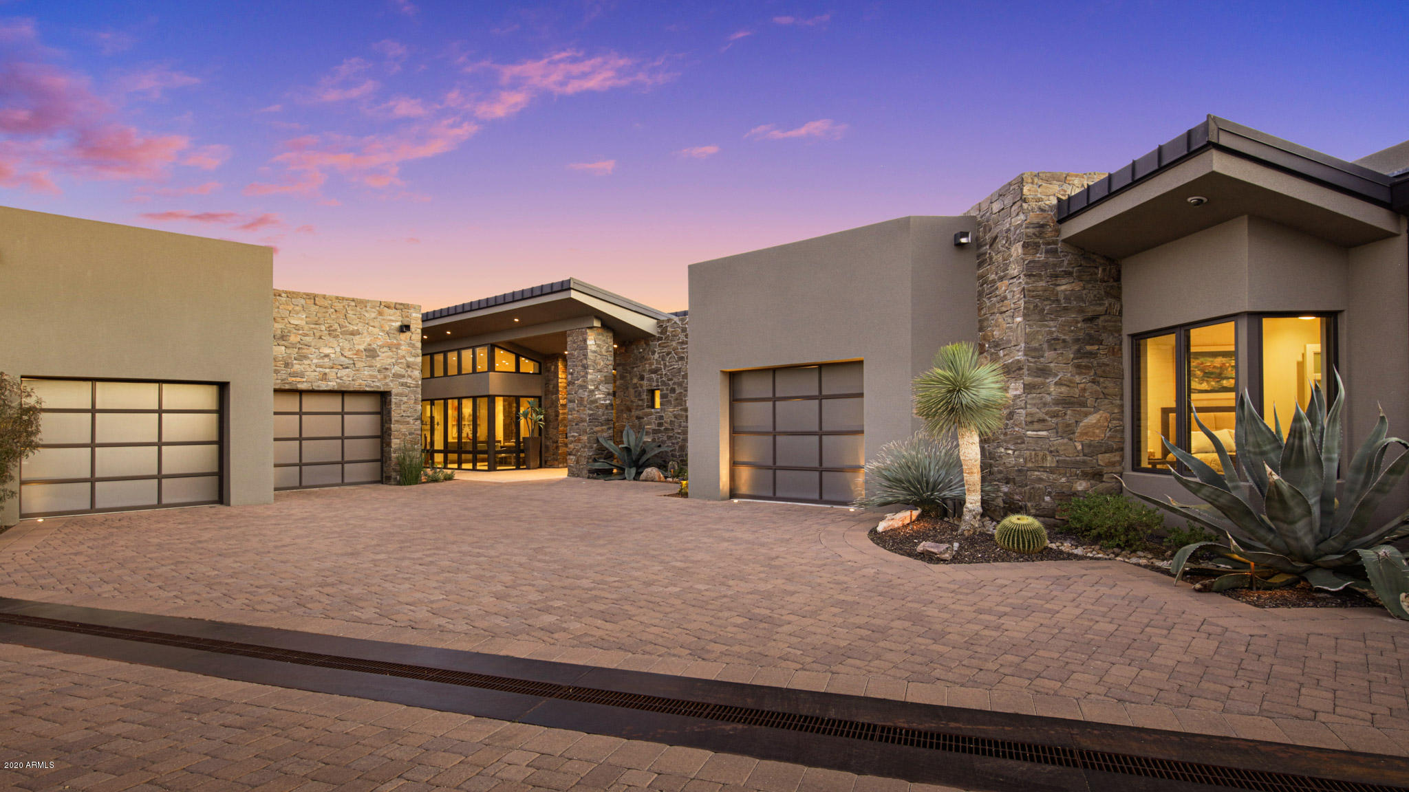 STUNNING CONTEMPORARY ESTATE nestled into a gated, private reserve in Desert Mountain's upper ''Canyon'' neighborhood provides unparalleled, forever views of the Valley, Sunsets and City Lights. With the touch of a button watch the retracting glass doors open to showcase the seamless flow from the gracious interior living spaces to an outdoor entertaining paradise with negative-edge pool . One-level main home boasts Great Room, Modern Chef's Kitchen, Master Suite, exercise room and home office. Today's Decor*Solar Panels *French Oak Hardwood Floors*3 Car Garage*Savant-Smart House*Audio/Video throughout*. The home has a complete automation system making all controls incredibly easy. The separate guest wing, boasts a full kitchen, 2 generous sized bedrooms, 2 baths, living room, laundry, private entrance and garage, complete with sunset patio. This home is simply a masterpiece, in every respect, set in the incomparable, 8,250 acre, gated community of Desert Mountain. Desert Mountain's entrance is an easy forty-minute drive to Phoenix Sky Harbor Airport. Most of the community is between 2,600 and 3,800' above sea level, which means daytime highs about ten degrees lower than what Phoenix reports, and nighttime lows as much as twenty degrees cooler. All property owners have access to a private, fifteen-mile hiking trail system.

Living in Desert Mountain provides very convenient access to the facilities of The Desert Mountain Club, an established, twenty-eight year-old, private club owned and governed by its Members, with a long list of amenities including six Jack Nicklaus Signature Golf Courses (along with four very well-designed golf practice ranges), six clubhouses with eight restaurants, one of the best golf performance centers in the country for swing analysis, lessons, golf club fitting, and golf club repairs; and horseback riding on a fifteen-mile long trail system located in and on top of the Continental Mountains at the rear of the 8,200 acre community (the trail system is an amenity for all Desert Mountain residents, not just Club Members). These trails rise to over 4,000' and provide astonishing views many miles in all directions.

One of the Clubhouses, the Sonoran Clubhouse, is the Club's swim, tennis, fitness and spa facility. A $12,000,000 expansion and renovation of that facility was completed in October, 2016 to much acclaim. Since then, six pickleball courts have been added, along with a golf croquet court and a bocce ball court. It is now a remarkable amenity, adding tremendous value and enjoyment to the community's Club Member residents. Membership to the Club is not included in the purchase price of this lot, but they are available upon application to The Club.