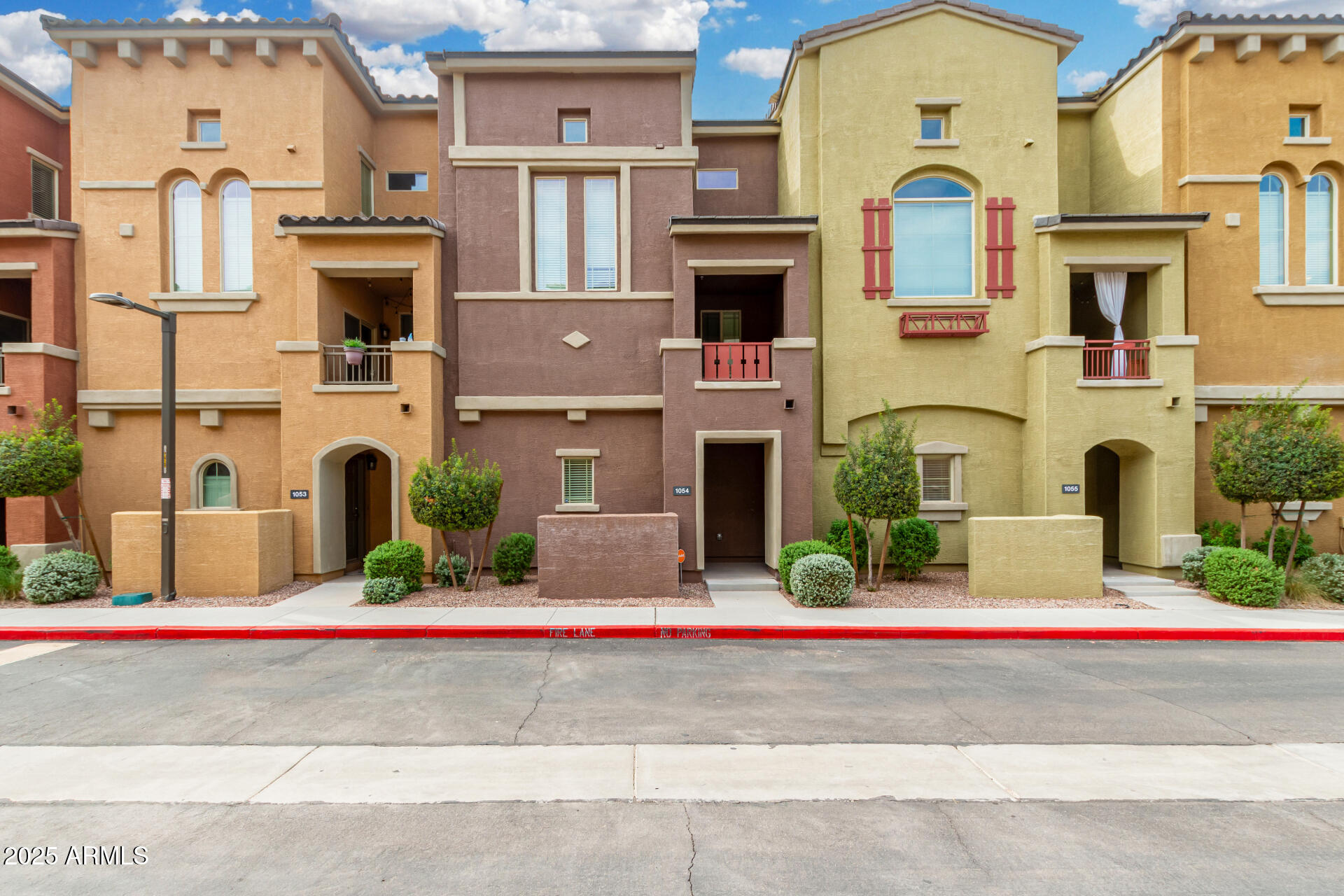 Easy living at its best...lock and leave or walk 5 minutes to the excitement of downtown Gilbert! Unit is great condition, DOM due to lender issues. This condo couldn't be more upgraded or better located!  Brand new plank tile flooring, brand new carpet, and brand new neutral paint with white accent molding. All brushed nickel light fixtures, faucets and door handles. The kitchen features white 
Shaker cabinets with crown molding, granite countertops and matching appliances. Wood blinds on every window and interior paneled doors. The powder room on the main floor has been upgraded as well.  All appliances, including the washer and dryer, convey.  Two Primary suites make this easy to have a roommate or out-of-town guests. There's a small ''what's the weather doing'' balcony too. There's a small "what's the weather doing?" balcony, too. The unit has a brand new water heater and  garage  ceiling rack for storage. Lots to do in the community...exercise room, volleyball, 2 pools, 2 children's playgrounds, and walking paths. All you have to do is move your furniture in and start enjoying these amenities and "the good life"!