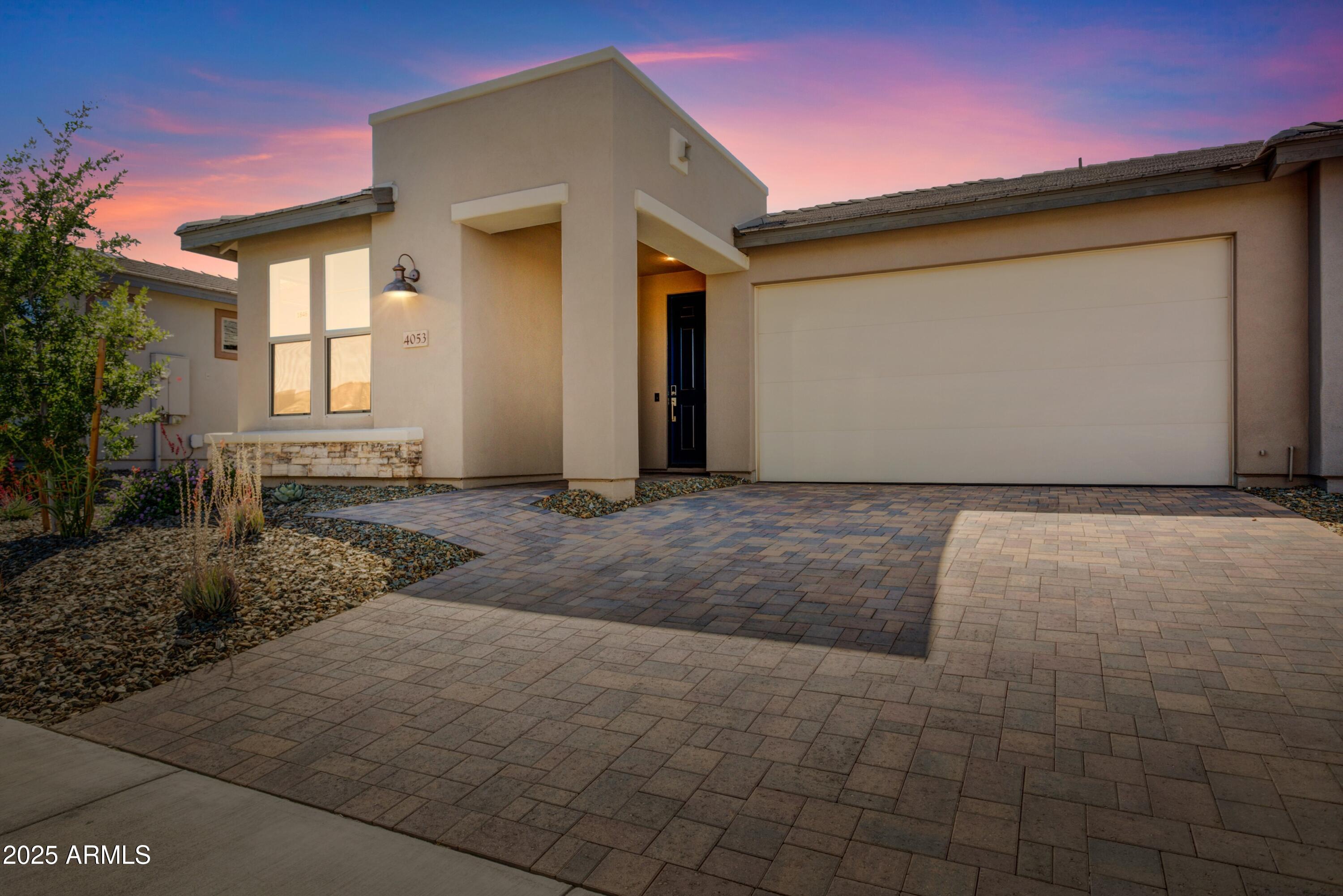 Shea-built Evia in the Resort Collection at Wickenburg Ranch. 1,552 sq ft, 2 bed, 2 bath, 2-car garage. Duet-style home w/HOA-maintained landscape. Quartz counters (Oxide & Slate Grey), Regal White soft-close cabinets, built-in stainless appliances, under-cab lighting & pendant lights. Great room opens to covered patio w/12' sliding glass wall. Spa-style primary bath w/heavy glass enclosure, ceramic tile & chrome fixtures. Includes upgraded flooring, custom paint, Smart Space laundry, AV wall sleeves, floor outlet & added electrical. Resort-style amenities just minutes away. Modern sophistication meets low-maintenance luxury in this Shea-built Evia floor plan, located in the Resort Collection at Wickenburg Ranch. This duet-style home offers 1,552 sq ft of open-concept living with 2 bedrooms, 2 baths, and a 2-car garageall on a beautifully maintained homesite with landscape service included in the HOA.

Upgrades throughout include quartz counters in both kitchen (Oxide) and baths (Slate Grey), full overlay Regal White cabinetry with soft-close drawers and doors, under-cabinet lighting, and stainless built-in appliances. The great room opens to a large covered patio through a 12' multi-slide glass door, creating the perfect indoor-outdoor connection. The spa-like primary bath features a heavy glass enclosure, ceramic tile, and chrome fixtures. Other highlights include custom paint, upgraded flooring, pendant lighting, floor outlet, Smart Space laundry, and added electrical and AV enhancements.