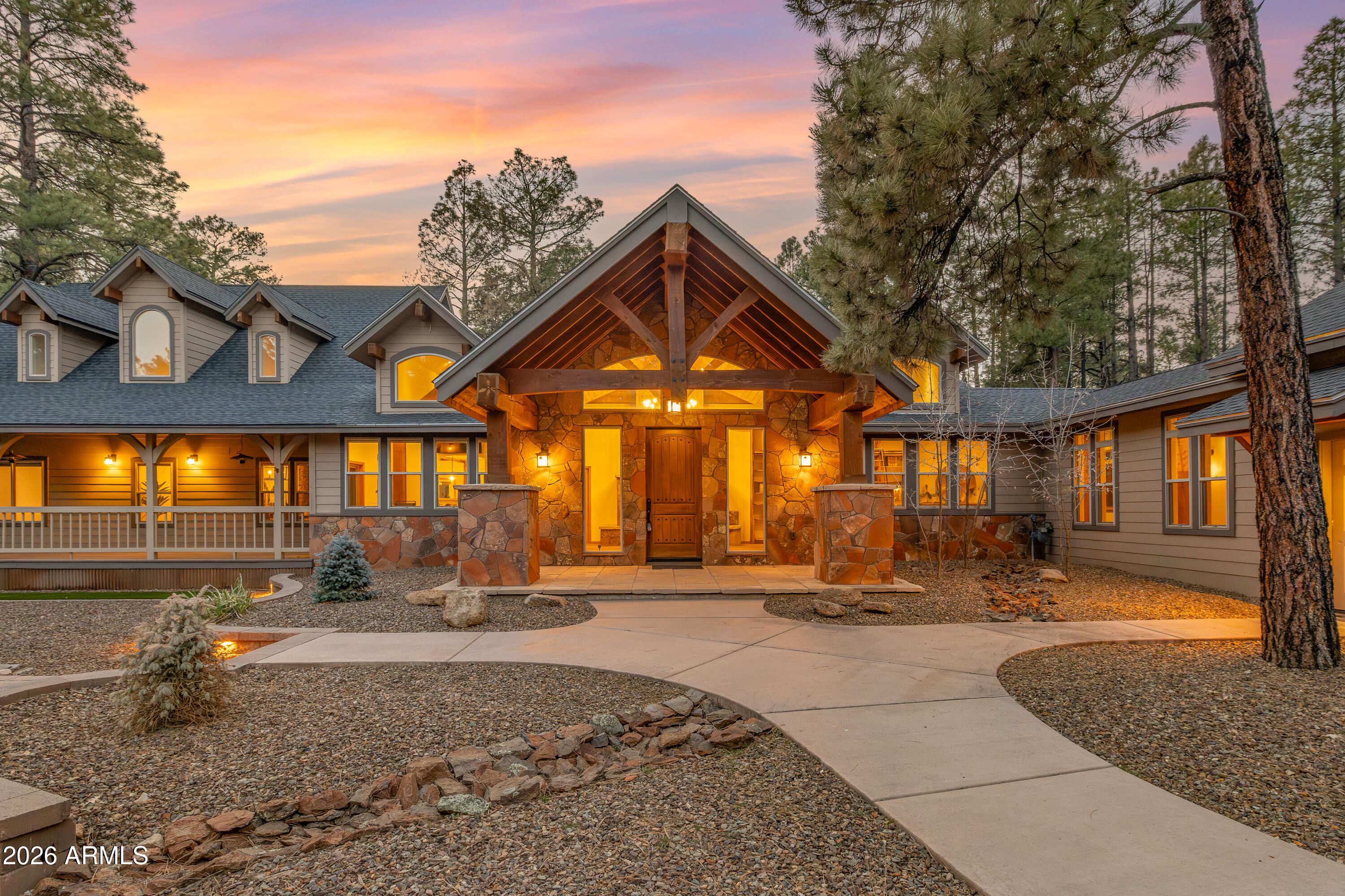 Set on just over two heavily treed acres in one of Flagstaff's most desirable neighbourhoods, this extensively remodelled mountain-modern estate offers nearly 4,850 square feet of flexible luxury living just minutes from town, hiking, golf, restaurants, and Flagstaff's best amenities.

Originally transformed through an extensive high-end renovation and recently refreshed again with major upgrades including new interior and exterior paint, updated designer fixtures, landscaping improvements, a remodelled kitchen, and a beautifully finished private guest suite, this home delivers a rare combination of quality, functionality, privacy, and long-term value.
The nearly single-level floor plan was designed for comfortable everyday living while still offering exceptional entertaining space. The large front gathering room creates a flexible centrepiece to the home -- ideal as a billiards room, mountain lounge, music room with bar, private library, media space, or relaxed entertaining area centered around the fireplace. The layout also works exceptionally well for multigenerational living, guests, or a private executive retreat with separated living zones that provide both openness and privacy.
Oversized windows frame the surrounding pines and bring natural light throughout the home while maintaining a peaceful sense of seclusion. Outdoor living areas and mature landscaping create an ideal lock-and-leave mountain property without the burden of excessive maintenance.
Unlike many luxury homes in Northern Arizona, this property offers surprisingly low ownership costs with low utility expenses, manageable upkeep, and an efficient, easy-to-maintain setup for a property of this caliber and size.
Located in one of the strongest lifestyle locations in all of Flagstaff, this is a rare opportunity to own a move-in-ready luxury mountain home that combines privacy, flexibility, convenience, and exceptional overall value.