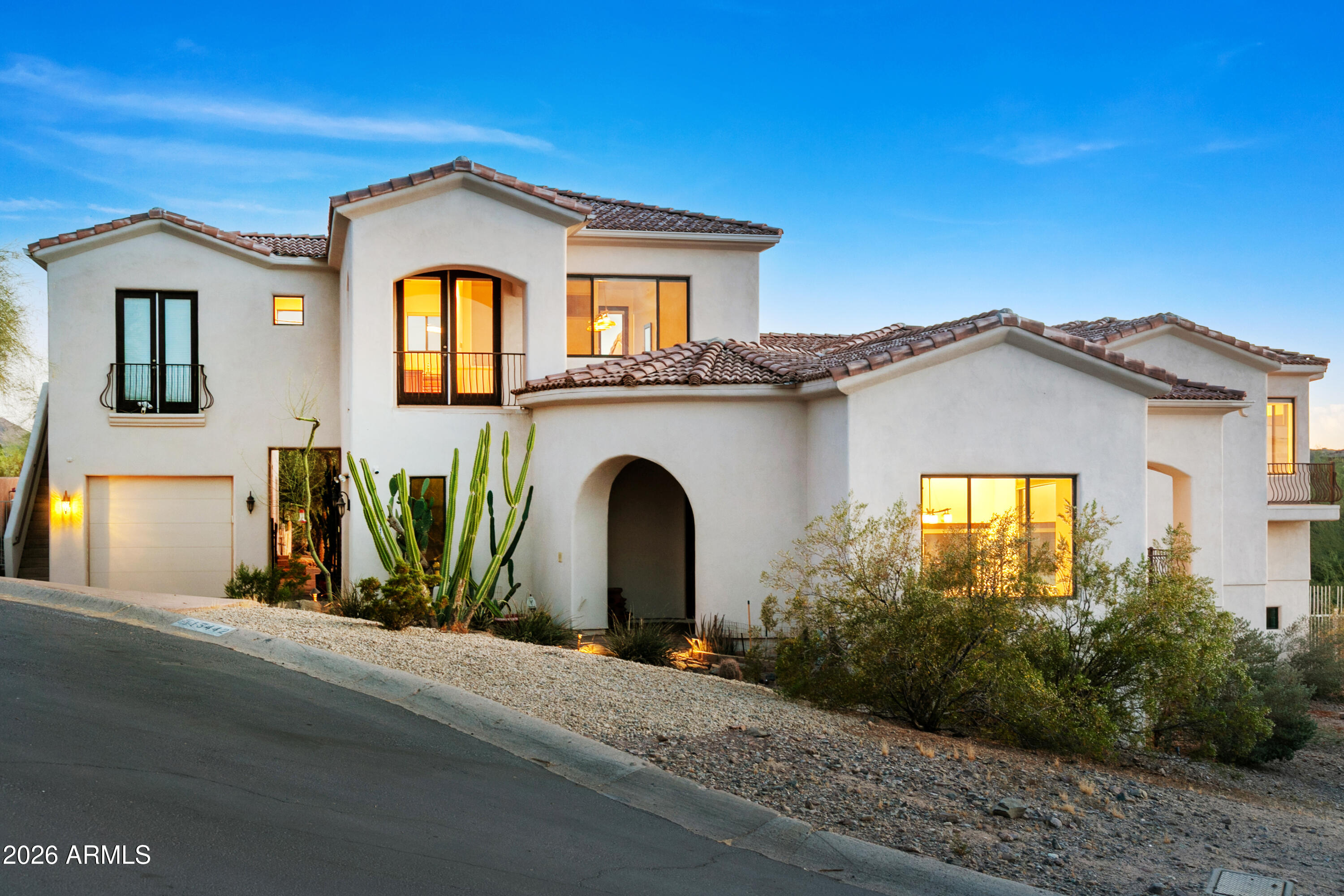 Custom Luxury & Panoramic Views with NO HOA FEES! Nestled on a .63-acre cul-de-sac, enjoy breathtaking mountain/city light views from this 5,055 sqft estate! This split-level home features 12' main floor & 10' bedroom ceilings, 8' interior doors, 5 balconies, 2 gas fireplaces, and a surround sound system. The kitchen impresses with multiple ovens, 2 granite islands, and an induction cooktop. The primary suite boasts 2 walk-in closets and a Japanese-style bath with a soaking tub and a Toto bidet. Enjoy an attached apartment with a kitchenette and private access! Entertain in the game room with a wine bar. Relax on the deck overlooking the pool, hot tub, and lemon/lime trees. Includes an attached 2-car garage, plus an AC tandem garage with a bathroom, perfect for a gym or hobby space!