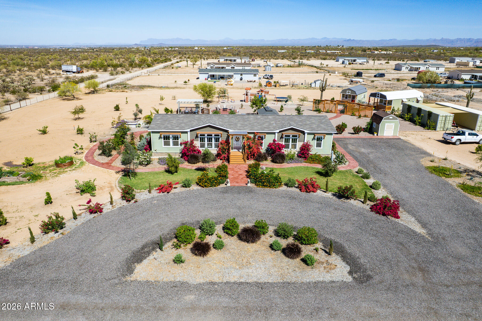 Set on a sprawling 2.5-acre irrigated lot with a private well, this beautifully upgraded property blends space, comfort, and versatility. The main home offers 4 bedrooms, 3 bathrooms, and 2,368 sq ft of thoughtfully designed living with stylish upgrades throughout. Enjoy your private outdoor retreat featuring a sparkling pool, gazebo, lush landscaping, garden areas, and extensive concrete walking paths--perfect for relaxing or entertaining. Adding incredible flexibility, two fully built-out tiny homes totaling 820 sq ft provide ideal space for guests or multigenerational living. A rare opportunity with endless potential in a serene setting, offering privacy, functionality, and long-term value, with room to expand, garden, or create your dream outdoor lifestyle.