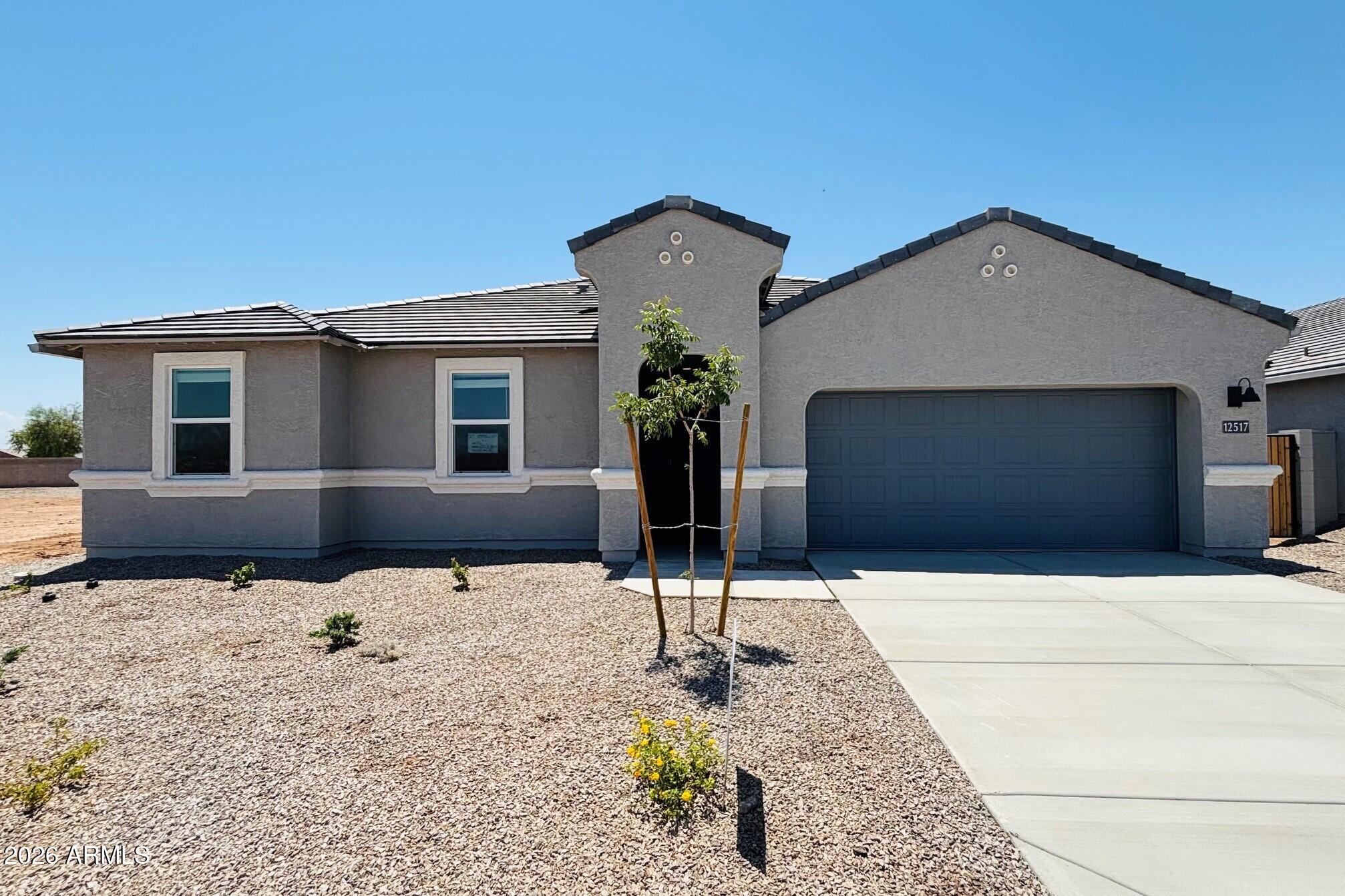 BRAND NEW | Home Ready Now | Pool Sized No Back Neighbor Lot w/ a Double Gate | Eureka! This home is the answer you have been searching for. The open kitchen flows seamlessly into the dining and living areas, creating an inviting space for family and guests. Interior finishes include granite kitchen & bathroom counter tops, white cabinets, and tile flooring throughout the entire house, except bedrooms. Smart home technology is included along with a 14 seer HVAC and energy saving features like spray foam insulation. Also, this home includes stainless steel appliances, 220v pre-wire in the garage, 2'' window blinds, garage door opener, rain gutters, plus front yard desert landscape. Come see this home in the desert's most sought-after hidden gem, Magma Ranch Vistas!