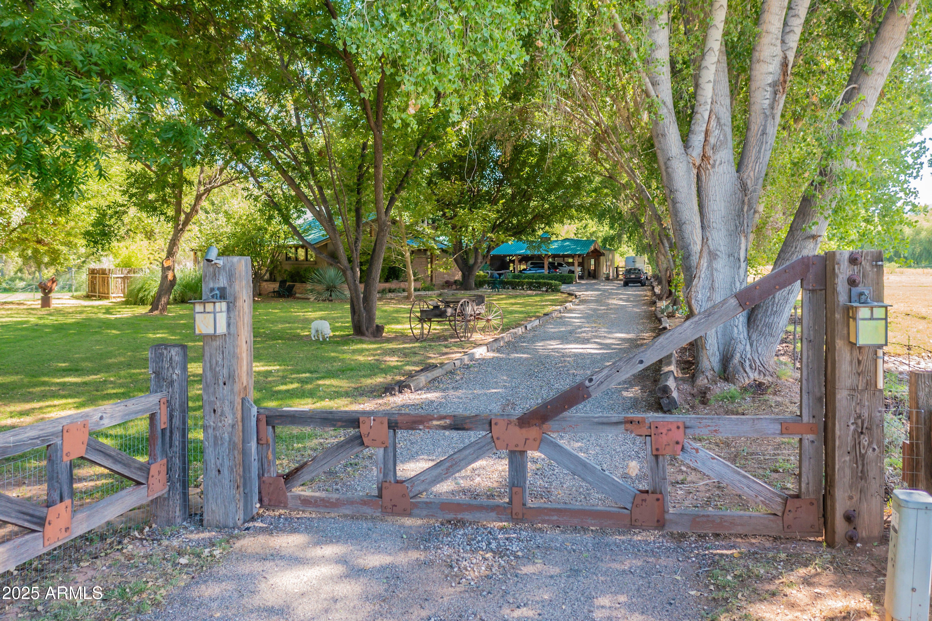 Very Rare Greenbelt Property on 3.5 Acres - A Hidden Gem!

Welcome to your dream retreat! Nestled on 3.5 ditch-irrigated acres of lush, tree-filled land close to river access, this one-of-a-kind custom home offers serenity, space, and stunning craftsmanship throughout.
From the moment you walk in, you're greeted by the warmth of hand-cut timbers originally sourced from Dead Horse State Park, setting the tone for the rustic elegance that defines the home. The expansive great room features a breathtaking fireplace and custom details at every turn. The chef's kitchen is a showstopper, boasting handmade wood cabinetry, exquisite granite countertops, and an open layout perfect for entertaining. Downstairs, you'll find two spacious bedrooms. One features a beautifully tiled en-suite bathroom, while the other offers panoramic river views and private access to the covered patio. Upstairs, the luxurious master suite includes a  bathroom and  windows that frame the tranquil river landscape.

Enjoy peaceful evenings or morning coffee on the expansive back patio that stretches across the home, ideal for taking in the natural beauty that surrounds you. The fully fenced yard adds privacy and charm.

Designed with equestrians in mind, the lower level includes a full horse stall setup. There's also an oversized two-car garage and a state-of-the-art workshopperfect for hobbyists, craftsmen, or additional storage.

Whether you're seeking a private sanctuary, a horse property, or a truly unique riverside home, this property is a rare find.