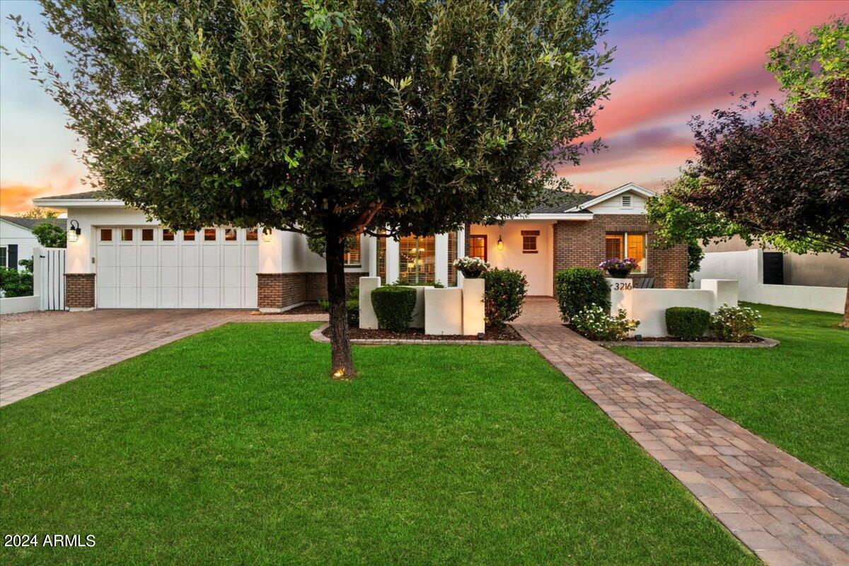 Exceptional design and craftsmanship in 2013 built, 4BD/3.5BA ranch style home in Golden Triangle where Arcadia, Biltmore and Paradise Valley intersect. Genuine oak wood flooring. Italian Carrara marble bathrooms. Stunning kitchen features oversized granite island with prep sink, custom soft close cabinetry, 5-burner gas cooktop, farmhouse sink, pot filler, dual-zone wine fridge, glass display cabinets, paneled appliances, huge walk-in pantry with barn door. Primary bedroom has French doors to patio, vintage inspired claw foot tub and lavish rain shower. Great room has custom 12' x 15' built-in and dual-zone surround sound. Amazing inside/outside living with extended paver patios, lush trees, grass, roses, irrigated vegetable boxes and producing peach tree. Furniture available for sale. Tankless hot water heater. Crown moulding and large profile baseboards. LED lighting. Custom shutters. Fully finished tiled garage. The list of upgrades is just tremendous. Non-through street limiting traffic. Located within a short distance to the best schools, restaurants and shopping. Walk to canal path to bike, run or walk the dog. Close to Piestewa Peak trailhead, Phoenix Preserve and Arizona Biltmore Resort. Seldom does a property of this level, in such a wonderful location, become available.
