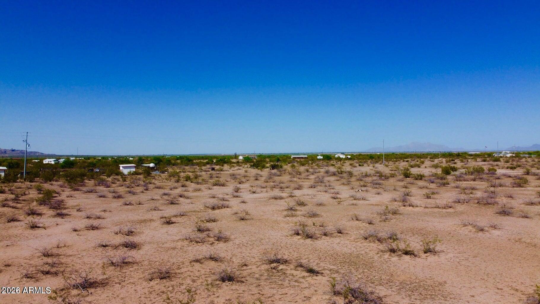 A 3.6-acre parcel of beautiful Arizona desert is ready for you to build your dream home on. Views of the sunset and mountains are breath-taking. In a quiet area yet close to Casa Grande, Eloy, Arizona City, this property offers an ideal lifestyle away from the busy lifestyle ! So the zoning for this lot is SR Suburban Ranch, which allows for site-built or manufactured homes, and outbuildings or guest houses. Horses allowed too.
