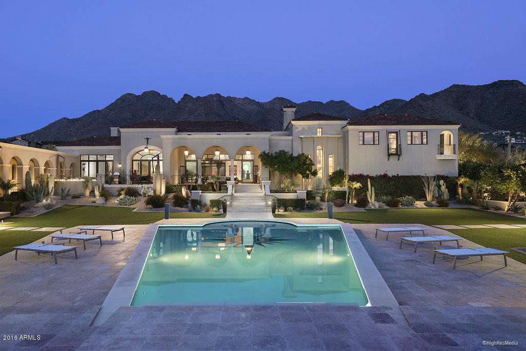 THERE HAS BEEN NOTHING TO COMPARE TO THE CONTEMPORARY MEDITERRANEAN GLAMOUR AND SOPHISTICATION OF THIS UPPER CANYON ESTATE ON TWO OF THE FINEST VIEW LOTS IN THE PRESTIGIOUS SILVERLEAF COMMUNITY. PASSING THROUGH THE PRIVATE ENTRY GATE AND WINDING UP THE LONG DRIVEWAY, THROUGH MATURE AND LUSH LANDSCAPING, THE STAGE IS SET. WHEN ENTERING THE HOME YOU CAN'T HELP BUT BE AWED BY THE BRIGHT, AIRY, AND OPEN FLOOR PLAN, THE DRAMATIC VIEWS AND THE CLEAN, REFINED AND SOPHISTICATED DETAILING – FROM THE ITALIAN FLOORING, TO THE CUSTOM LIGHT FIXTURES,  ELECTRONIC SLIDING GLASS WALL DOORS, CARERRA AND LIMESTONE COUNTERTOPS, DESIGNER CHEF'S KITCHEN, BEAUTIFUL WATER AND DRAMATIC FIRE FEATURES, THE LIST GOES ON AND ON. WHETHER LOUNGING IN THE ESTATE POOL, LAP POOL, 2 SPAS, ENCLOSED POOL CABANA, LUXURIOUS HOME THEATER OR GAME ROOM, THE EXPERIENCE IS MEMORABLE.  THE MASTER SUITE AND OFFICE ARE UNPARALLELED AND THE SECONDARY BEDROOMS EXPANSIVE.  NO DETAIL HAS BEEN OVERLOOKED, INCLUDING A BEAUTIFULLY APPOINTED PRIVATE GUEST HOUSE, 1,000 BOTTLE WINE CELLAR AND CARETAKERS QUARTERS.  ONE CAN'T HELP BUT MARVEL THAT AN ESTATE OF SUCH QUALITY AND GRANDEUR CAN EXUDE THE WARMTH AND EASE OF LIVING YOU FIND IN THIS FAMILY HOME.