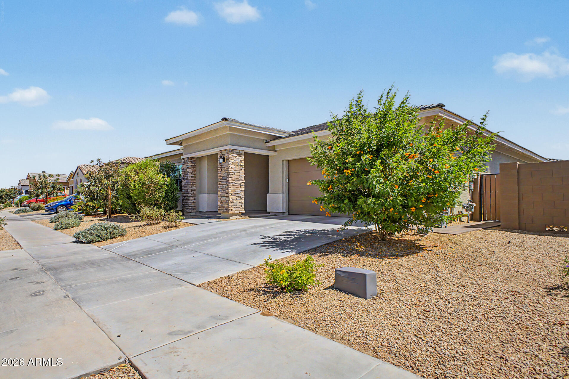 Welcome to this stunning, nearly new home built in 2023, offering modern comfort and thoughtful design throughout. Featuring 4 spacious bedrooms, 2.5 bathrooms, and a versatile bonus room, this home provides plenty of space for living, working, and entertaining. Step inside to discover soaring ceilings and an open, airy layout filled with natural light. The heart of the home is the chef's kitchen, complete with a massive island, sleek finishes, and ample space for cooking and gathering. Out back, enjoy a beautifully professionally landscaped yard designed for both relaxation and functionality. Highlights include elegant travertine, stylish pavers, and a raised garden bed--perfect for outdoor dining, gardening, or simply unwinding. Conveniently located with easy access to the Loop 202 South
