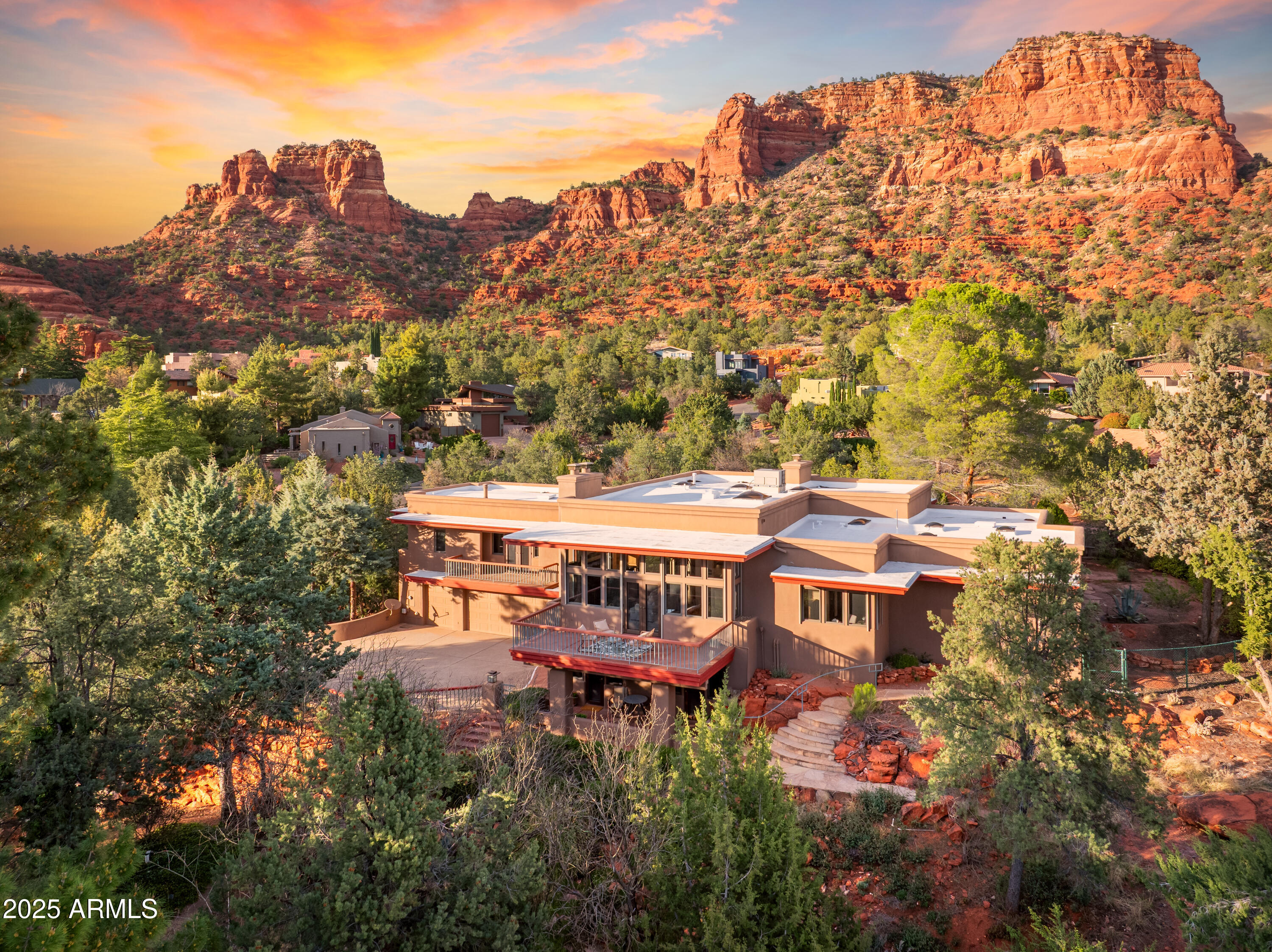 2 lots together ( PN 405-29-100-C& 405-29-100D) equal 1.22 acres. Open your private gated bridge to enter this beautiful oasis perched above the 15th green of The Oak Creek Country Club Golf Course. Breath taking views of the Red Rocks from inside as well as patios and balconies. Enter front door to a beautiful hardwood staircase or take the elevator. Extensive linear gallery that architecturally separates the Library/office and 2nd bedroom suite from the formal Living room, Dining room Primary suite, Family room and kitchen. This gallery is set off by the Wright inspired sky lights and light fixtures. . 115 MERRY GO GROUND ROCK RD
405-29-100C ( .55 Acre )= 
Built in 1992, Architecture by JOHN KAMAS
BUILDER: GAYLE 
ARCHITECTURAL GLASS ARTIST TOM ADERHOLD, DESIGNED " FRANK LLOYD WRIGHT " style SKY LIGHTS, SCONCES AND OUTDOOR LIGHTS
All fireplaces are gas ( propane). All four fireplace fronts ( Formal living room, Formal dining, Family room lower level guest suite) are of Italian Marble, wood is believed to be Mahogany. Wood burning stove in Library.
Elevator from lower level
Remote controlled Sunscreens on south windows.
75 gallon water heater replace in 2024
3 HVAC SYSTEMS
169 Ft frontage onto the 15 th green of The Oakcreek County Club Golf course.
North views of Castle Rock and adjoining Red rocks.
North adjoining lot 405-29-100D  ( .61 Acre ) IS INCLUDED WITH THIS SALE