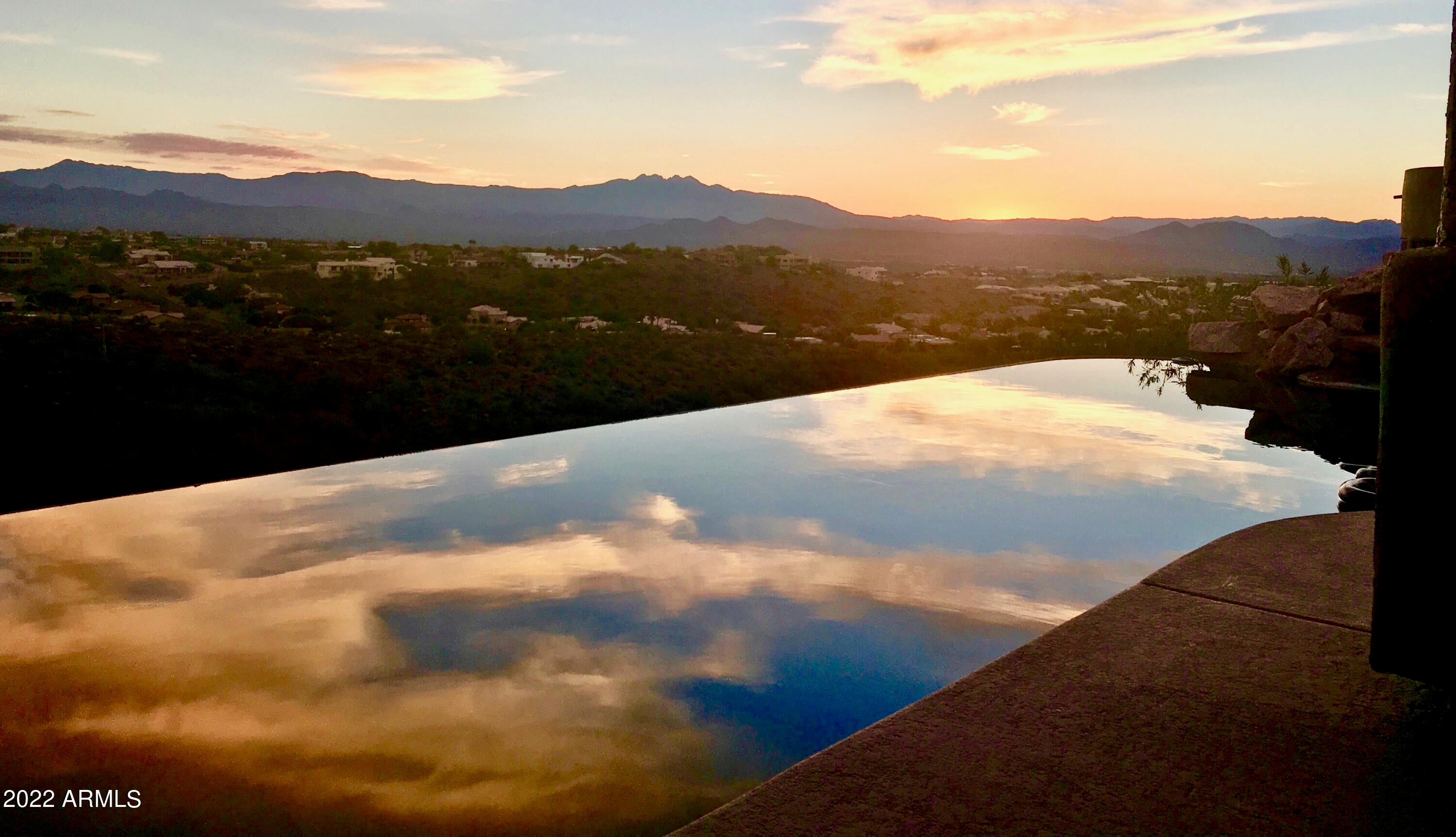 You Have to come look at the views from the back of this home and One of Fountain Hills' most dramatic arroyos w/huge views of 4-Peaks Mountain. On 1.97 Acres with 3279 sqft upstairs & 643 sqft down, there's a 5 Car Garage (3/up, 2/down) plus a Bonus 200 Sqft of Storage space Downstairs, Guests have a large living quarters & separate entrance. Located on one of Fountain Hills' most prestigious streets, amid numerous million dollar homes and extraordinary views. This home was finely crafted and engineered to be as timeless as the stunning mountain views. Beautiful finishes, updated Kitchen, baths w/granite, tile, and remodeled Family room, gas fireplace and THOSE MILLION DOLLAR VIEWS.  If your looking for a awesome home for your family  this is the one! Come see it today.
