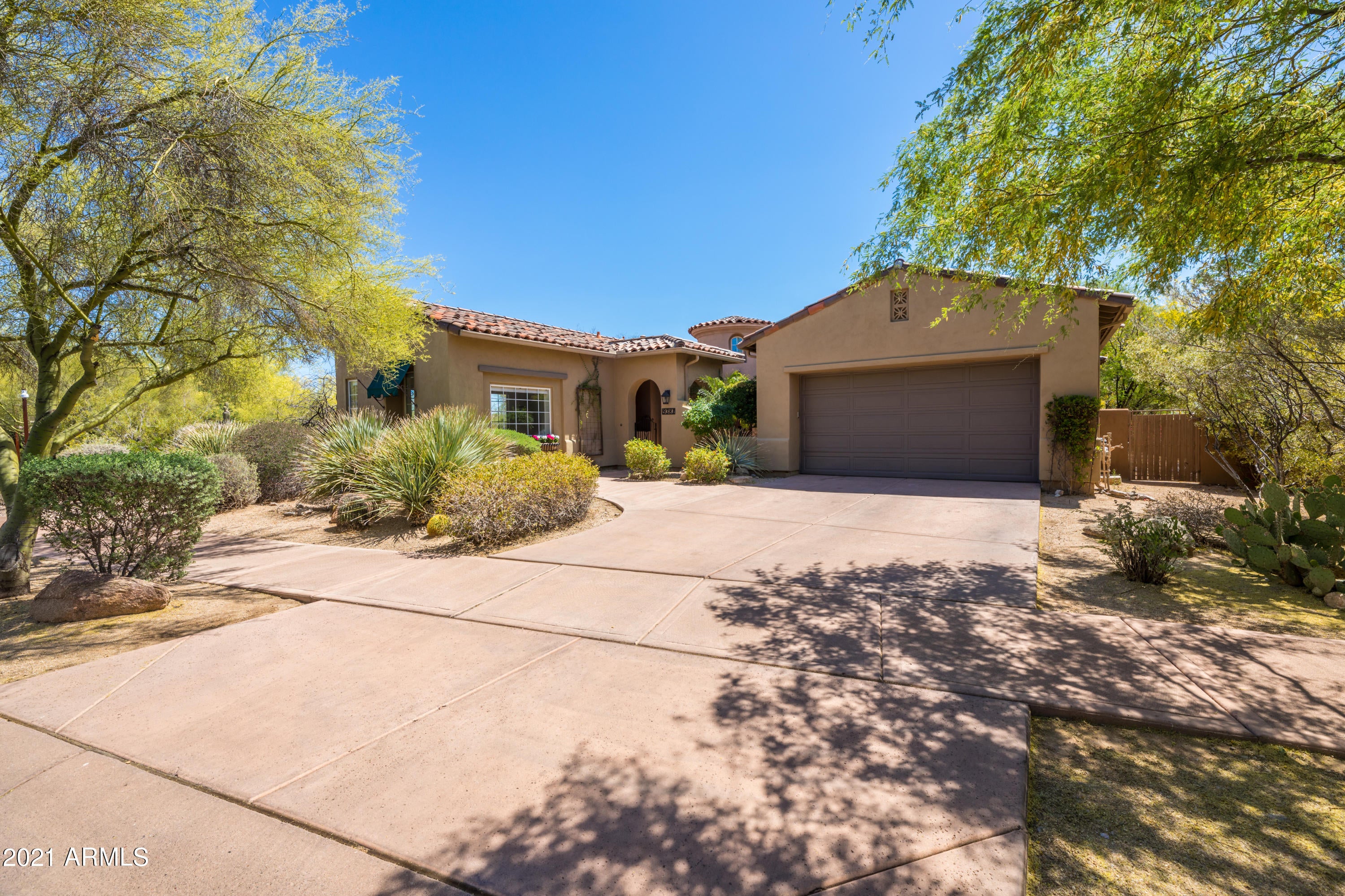 Charm in the Desert. This popular sought after Artemina model with a Great Room Floorpan, no interior steps, built by Camelot Homes boasts beauty & charm & includes Gorgeous wide planked wood floors, Neutral Finishes,  3 Bedroom (1 oversized Bedroom, can be second Master, 2.5 Bath , White kitchen cabinets with upgraded appliances . Open floorpan allows for large gatherings & entertaining. Private Backyard is a desert oasis with minimal maintenance & Stunning Mountain Views & Twinkling City Lights. Enjoy AZ Sunsets Nightly! One covered patio in backyard & one side Courtyard with Cozy Fireplace, allows for outdoor dining. Community Center located around the corner with Heated Pool/Spa, Gym, Tennis/Pickleball Courts, B-Ball Courts, & playground. All amenities included in your monthly HOA dues. The perfectly located community of DC Ranch offers Biking & Hiking trails throughout the community, close to Shopping & 101 Freeway access.  Gated Community. This home is Fresh & Neutral & just waiting for you to make it your AZ Retreat!
