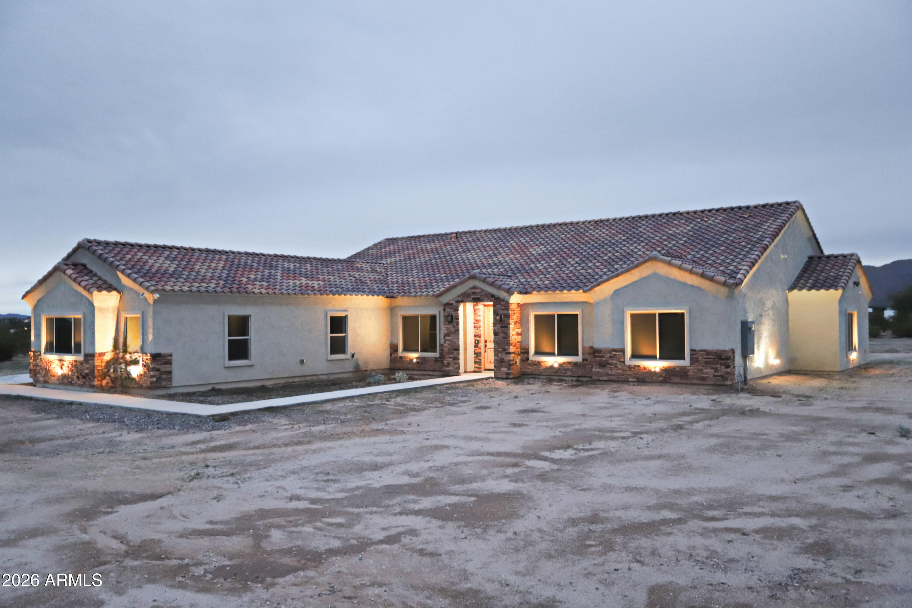 This stunning custom home sits on over 2 acres in the highly desirable Las Montanas community. Designed with quality and comfort in mind, the home features high-end tile throughout, 5 spacious bedrooms, 3.5 bathrooms, a large granite kitchen island, elegant pendant lighting, and beautiful knotty alder doors.

The expansive lot offers endless possibilities, with breathtaking mountain views from every angle. The flat, usable land surrounding the home is ideal for a barn, horses, pets, or grazing, making it perfect for those seeking space and versatility. This is truly a dream home for anyone looking for a peaceful yet luxurious place called, home