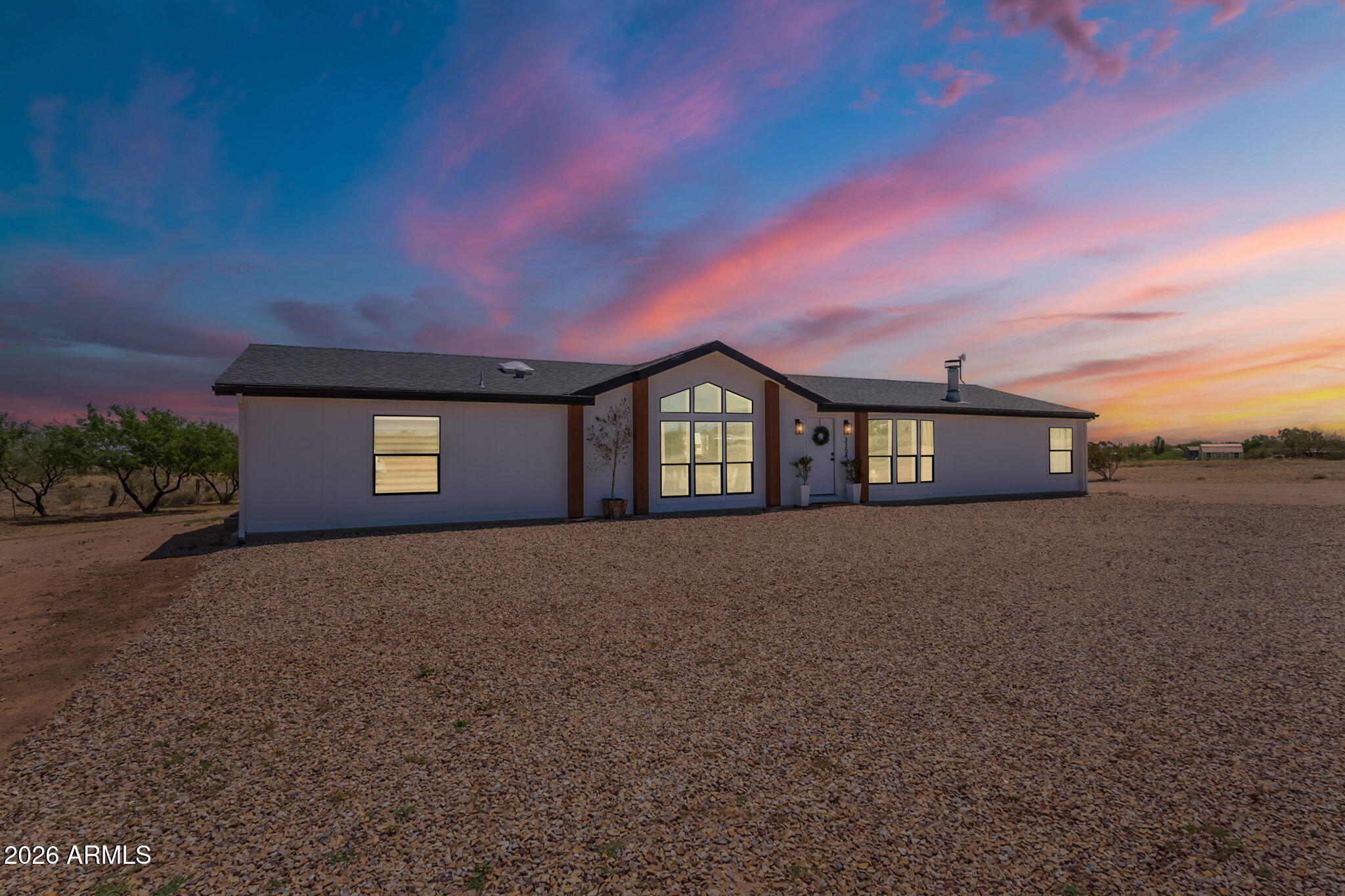 This beautifully renovated 4-bedroom, 2-bath manufactured home sits on over an acre, offering 2,240 sq ft of spacious and comfortable living. Tucked in a peaceful setting while still close to shopping, schools, and easy I-10 access, the location provides both convenience and a sense of retreat--just a short drive to Ft. Huachuca and Vail.

Inside, you'll find a bright, open layout with generous bedroom sizes, multiple living spaces, and plenty of flexibility for entertaining, working from home, or accommodating extended family. The updated kitchen, refreshed finishes, and upgraded flooring create a clean, modern feel throughout. Step outside to enjoy a thoughtfully maintained yard with mature trees, a cozy gazebo for relaxing, and ample room to expand, garden, or simply enjoy the outdoor