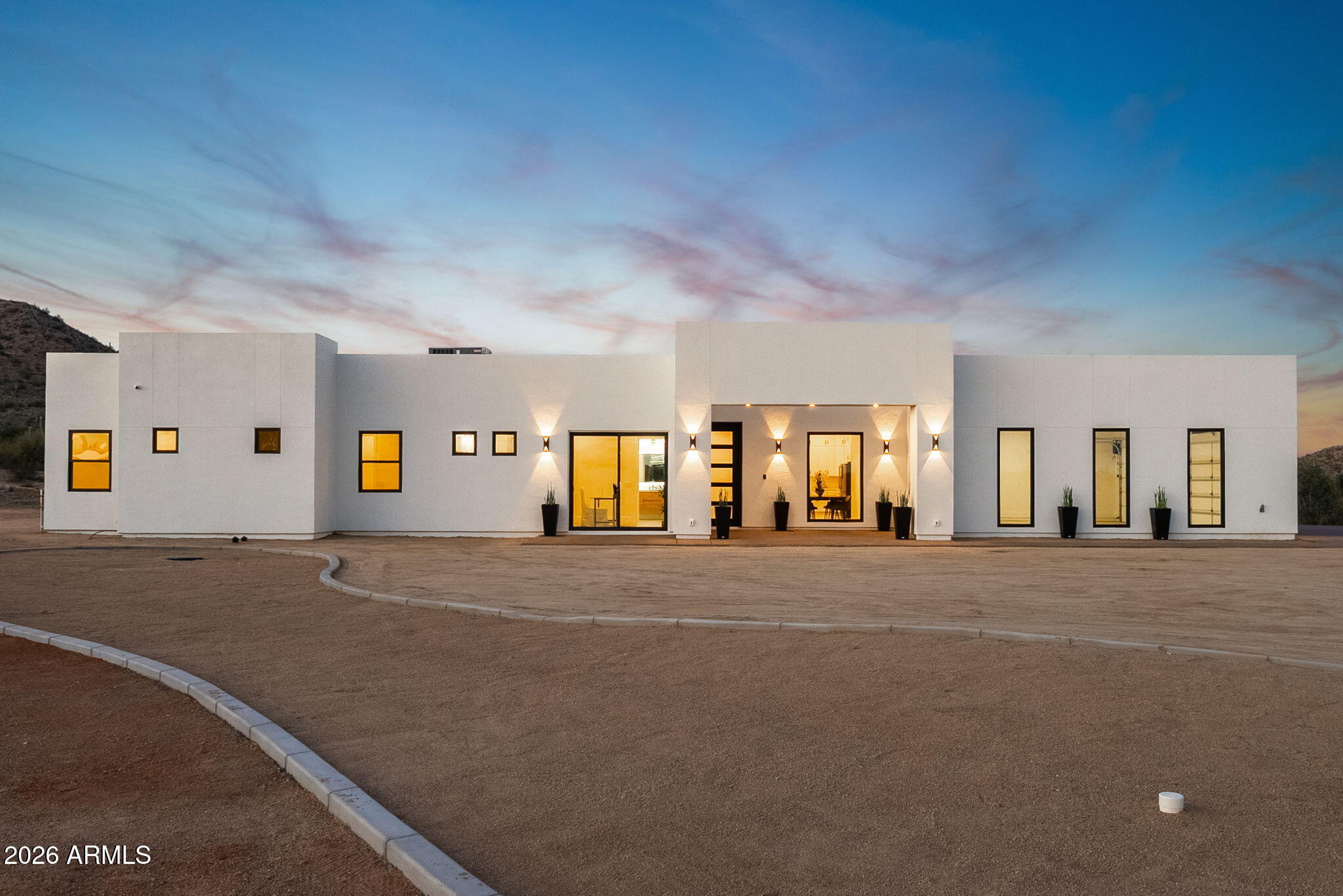 Major price improvement on this brand-new 2026 custom home on 3.4+ private acres with no HOA. Move-in ready and built with quality 2x6 construction, energy efficiency, and a remarkable HERS rating of 47. Designed for buyers seeking privacy, space, and luxury beyond the typical subdivision lifestyle. Features include a resort-style pool, turf, soaring vaulted ceilings, designer finishes, open-concept living, oversized 3-car garage, and a hidden secret room. Enjoy your own private well, new septic system, panoramic mountain views, and breathtaking Arizona sunsets surrounded by mature saguaro cacti. Horses welcome, with endless room for RVs, toys, guest casitas, future shops, and more--all with the freedom of no HOA. Rare opportunity to own true Arizona desert luxury with privacy on 3.4 Acres