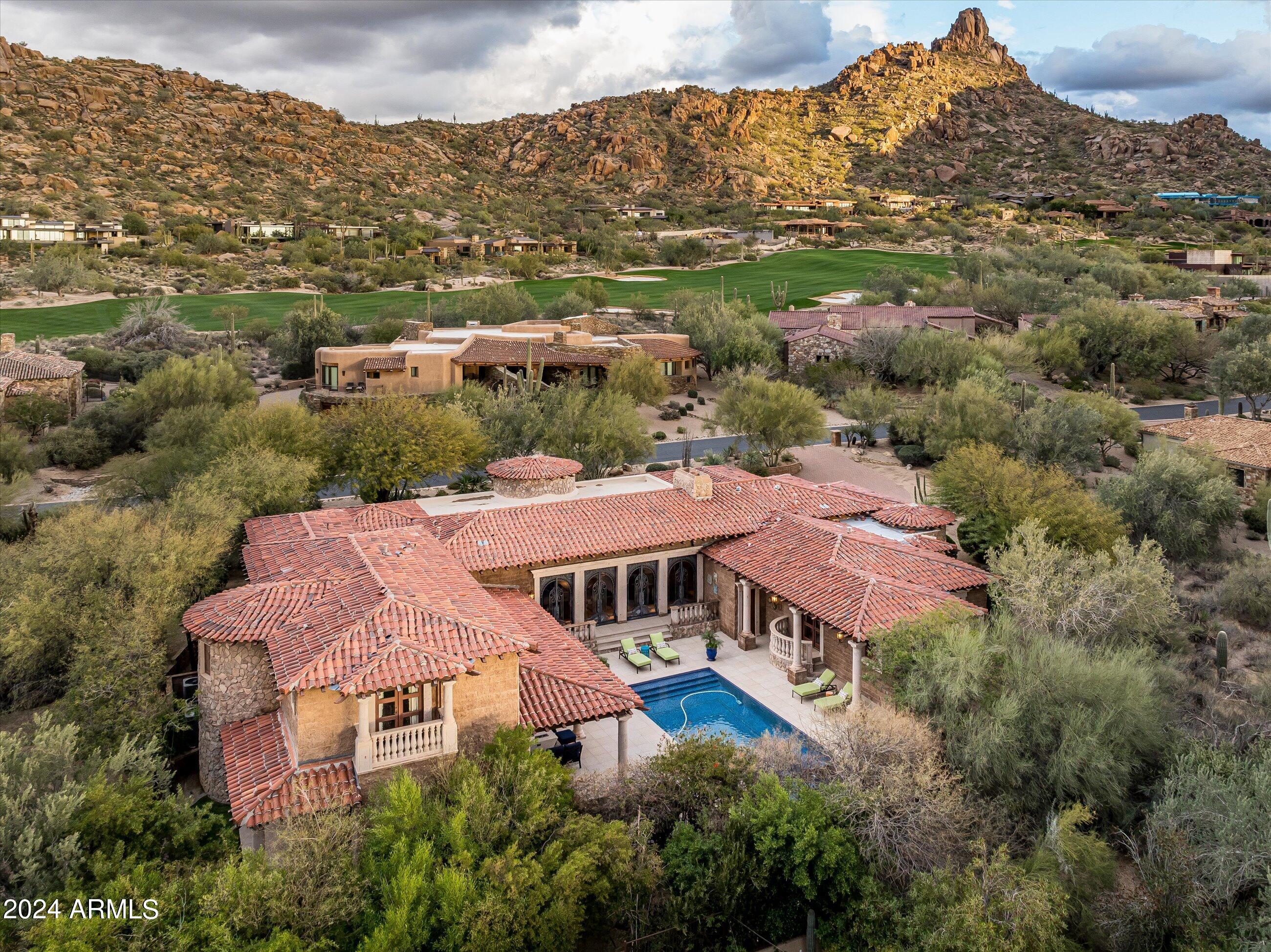 GOLF MEMBERSHIP TO THE ESTANCIA CLUB AVAILABLE SUBJECT TO BOARD APPROVAL * One of the finest interior lot residences in the Estancia subdivision, offering extreme privacy with large and elegant living spaces (7,587 square feet) * The finish materials and attention to detail are truly spectacular! * Extensive use of cantera stone, granite and wood create a relaxing and elegant oasis for year round living * The outdoor living area is designed taking full advantage of the warm winter sun while granting large covered patio space to accommodate any weather condition throughout the year * From the large living room, to the home theater all the details have been included in this design for elegant, yet comfortable desert living *