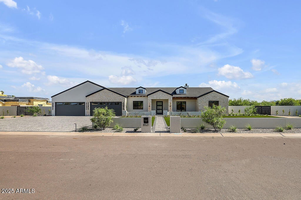 Welcome to Milco Development's latest luxury residence. An expansive modern farmhouse nestled on over an acre in the prestigious Cactus Corridor of Scottsdale. This stunning property has been built for the way families live today, featuring 6 bedrooms, 8 bathrooms, a 6-car garage, and plenty of room for all your toys. Step inside and you're greeted by soaring ceilings, natural light, and an open layout that feels both luxurious and livable. The heart of the home is a stunning gourmet kitchen featuring Sub-Zero, Wolf, and Cove appliances, along with a fully equipped butler's pantry, perfect for weeknight dinners or weekend entertaining. Overlooking the spacious living and dining areas, so you're always part of the conversation. With five bedrooms, five baths, and 2 powder baths in the main house, everyone gets their own spaceand every bedroom has its own en-suite, making mornings a breeze. The separate living area provides kids or guests with a space to unwind, and there's room for everyone to feel at home. Step outside, and the real magic happens. A sparkling pool, relaxing spa, Pickleball Court, and a private 1-bed/1-bath guest house make the backyard an everyday retreat. Whether it's summer BBQs, weekend Pickleball tournaments, or quiet evenings under the stars, this space has it all. Just minutes from shopping, dining, and everything you need, this home isn't just beautiful, it's built for your life.