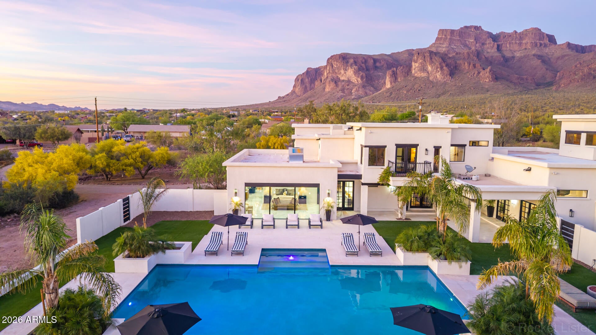 Desert adventure meets resort-style luxury in this beautifully remodeled 2.2 acre custom estate at the base of the Superstition MTNS featuring one of the most stunning backyards/pools in the valley. Review pics & doc tab for full list of upgrades! 4 beds, 4 baths, plus a den, bonus room & theatre room! Two master bedrooms (down & up). Huge oversized 3 car garage, covered RV parking, additional parking/storage areas! Gorgeous mountain views & city lights. Luxury highlights include new tile & wood vinyl floors 2026, quartz countertops/backsplash 2026, refinished cabinets & butcher block 2026, GE appliances! Newly added master suite has marble shower, standalone tub, new vanities & fixtures 2022! Incredible pool/spa & outdoor kitchen built in 2022! Priced well below recent appraisal! NO HOA!!