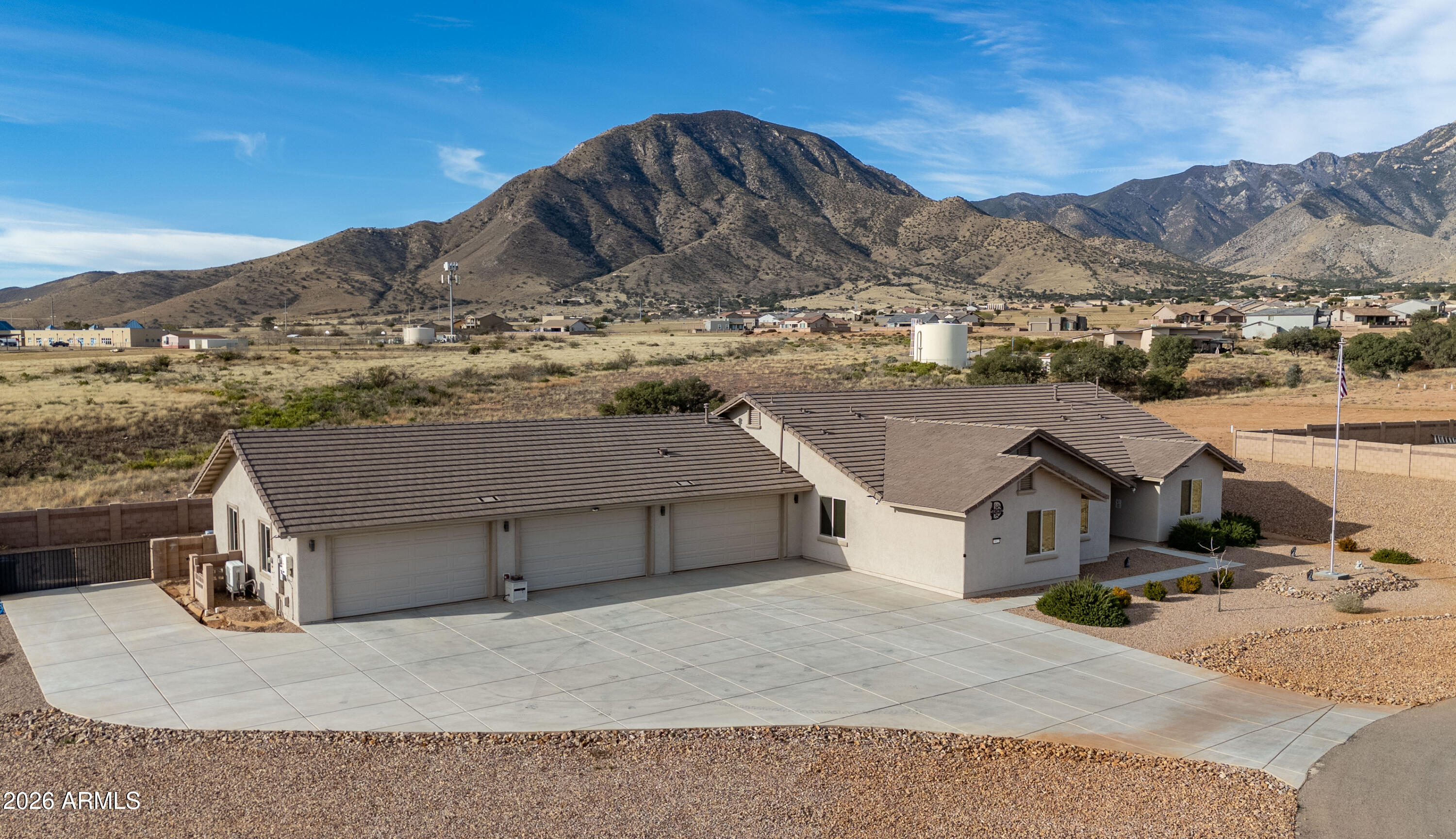 Luxury desert living awaits in this stunning custom 5-bedroom executive home in the exclusive King's Ranch community! Enjoy spectacular mountain and valley views, a massive heated/cooled 6-car garage, beautiful Arizona Room, owned solar, and countless custom upgrades throughout. Designed for comfort, efficiency, and entertaining, this move-in ready home offers the perfect blend of elegance and functionality. A rare opportunity you won't want to miss!