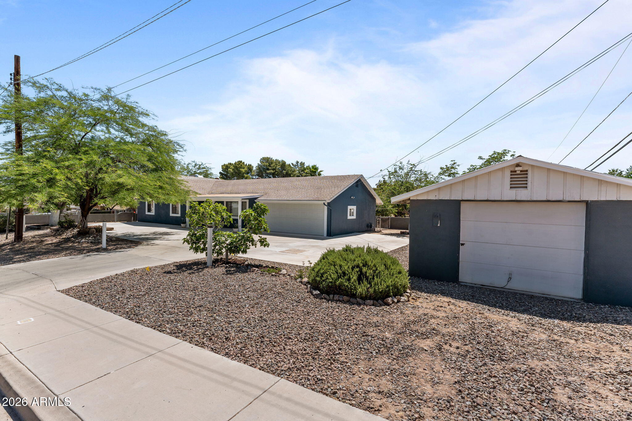 Well-maintained home situated on a desirable corner lot with North/South exposure, featuring a detached garage/workshop and plenty of space for RV parking and recreational toys. This 3-bedroom, 2-bath home offers walk-in closets in every bedroom, an updated kitchen with granite countertops, stainless steel appliances, and a gas range. Enjoy the spacious dining area and large living room, perfect for relaxing or entertaining. Additional features include a 2-car attached garage, oversized laundry room, fenced yard, and mature trees that provide shade and charm. Conveniently located near downtown with easy walking access to shopping, dining, and local amenities.