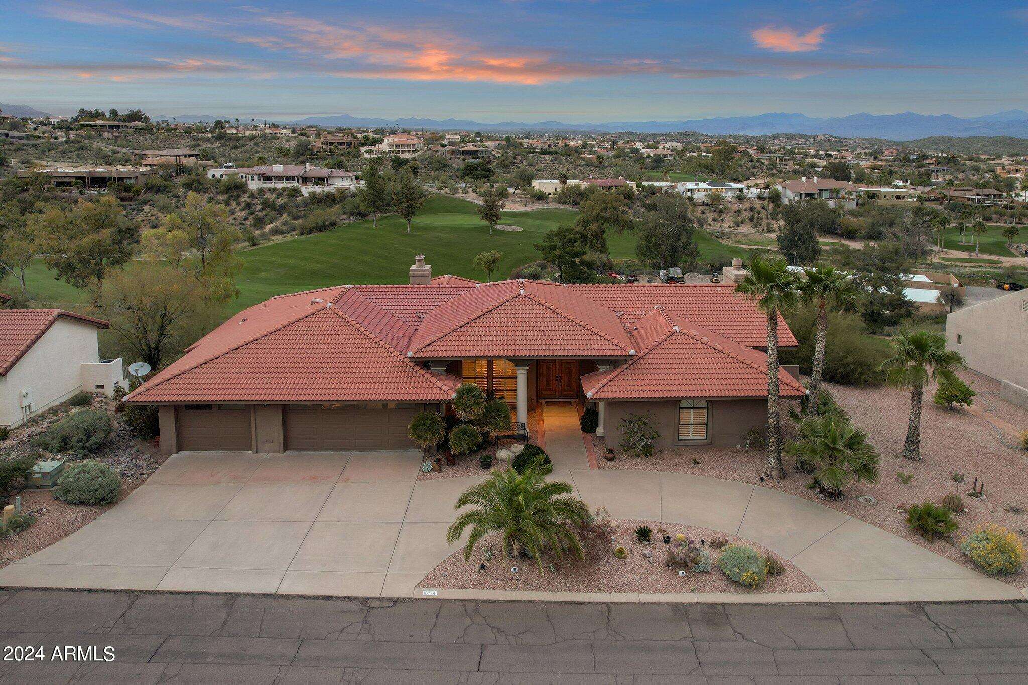 This stunning 4 bed, 3.5 bath home on Desert Canyon Golf Course marries modern luxury & skillful design w/ tasteful upgrades throughout! Boasting 3460 sqft of generous living space, this home encompasses crisp white plantation shutters and splendid mountain views of Four Peaks and the McDowell mountain range as well as the 8th green, 9th tee, pond and 10th and 11th Fairways! 3 bedrooms on the main level ensures lots of room for work, play and rest for everyone.Through the sliding glass doors is a generous custom pool perfect to take in the views. Enjoy a luxurious primary suite complete with ensuite bath boasting dual vanities, separate tub and shower and walk in closet. The lower level features a huge bonus room perfect for entertaining with wet bar, place for a full refrigerator and... a fireplace.  A convenient additional bedroom and bathroom completes the lower level.  Rest easy knowing this home has a brand new roof installed in 2024! This home is sure to impress!