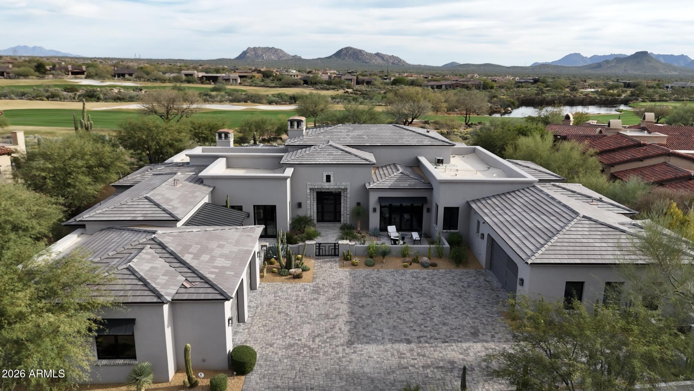 Resort-style living in Mirabel Club with a separate casita. This beautiful custom home offers seamless indoor/outdoor living with multiple pocket doors opening to a spectacular backyard overlooking the 10th fairway and water feature. Expansive great room plan, chef's kitchen, glass-enclosed temperature-controlled wine room, office with courtyard access and indoor/outdoor entertainment bar with pass-through seating. Southeast-facing yard with pool, spa, outdoor kitchen, fireplace, fire pit and patio heaters, plus 4-car garage on a quiet cul-de-sac flag lot near the clubhouse. Home is offered furnished.