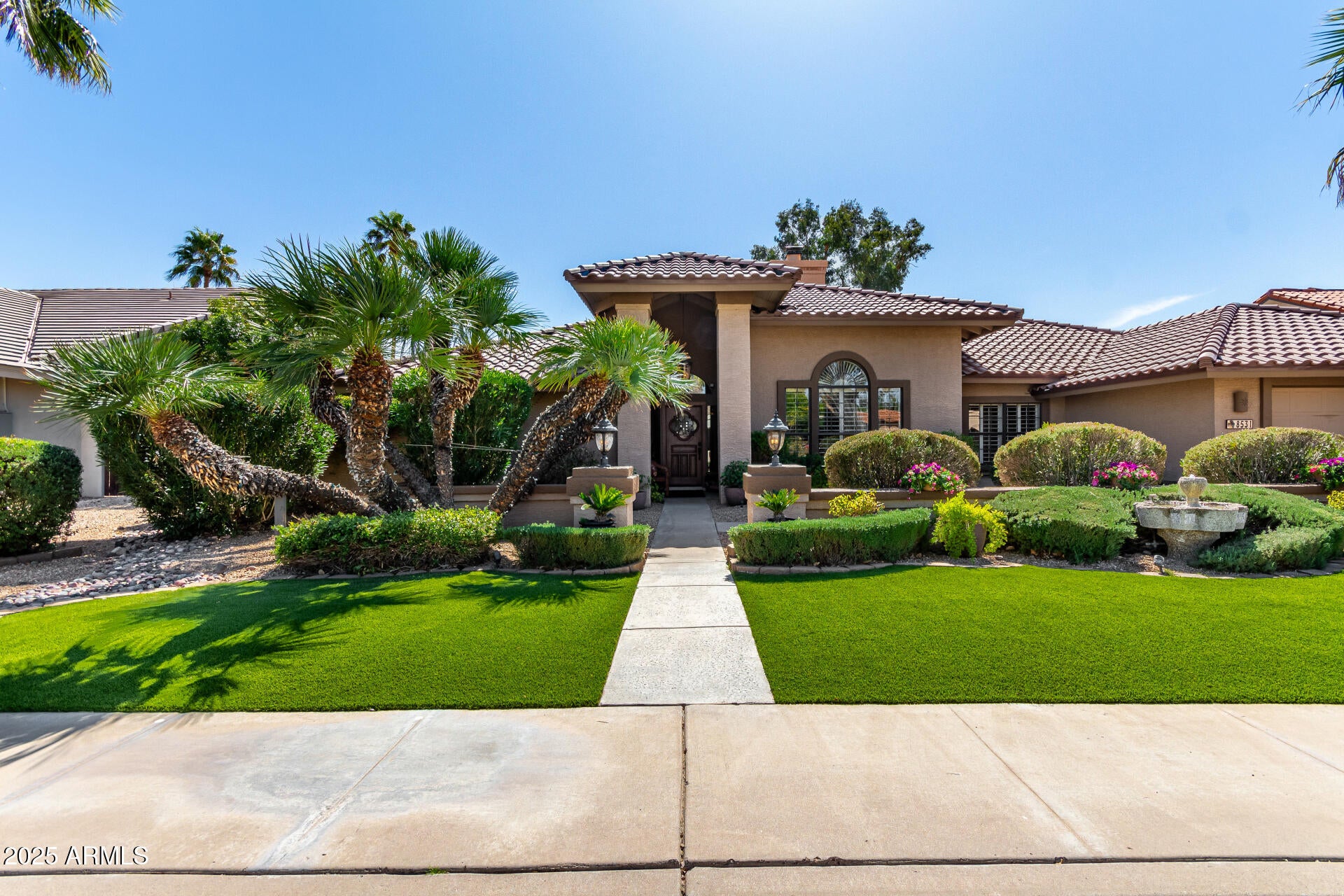 This fantastic McCormick Ranch 4-bdr, 3-bath home has plantation shutters, granite countertops, double fireplace, wet/wine bar, travertine & wood flooring and wood-beam vaulted ceilings.