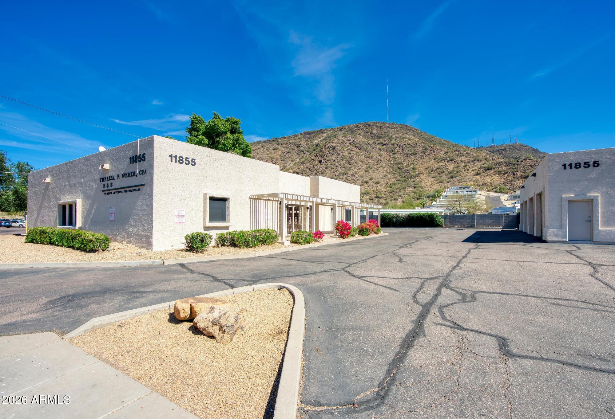 This premier flex opportunity at 11855 N 19th Avenue consists of two versatile structures on a substantial ±22,500 SF lot.
The property features a ±3,108 SF professional office building with a freshly painted interior, including eight private
offices, two bullpen areas, a reception area, and a breakroom. Complementing the office is a ±2,400 SF warehouse
with four roll-up doors and a private restroom. For additional utility, the site includes a detached conex container with
two additional roll-up doors. The property is strategically located with high-visibility frontage on 19th Avenue and offers
immediate, efficient access to Interstate 17 for regional connectivity.