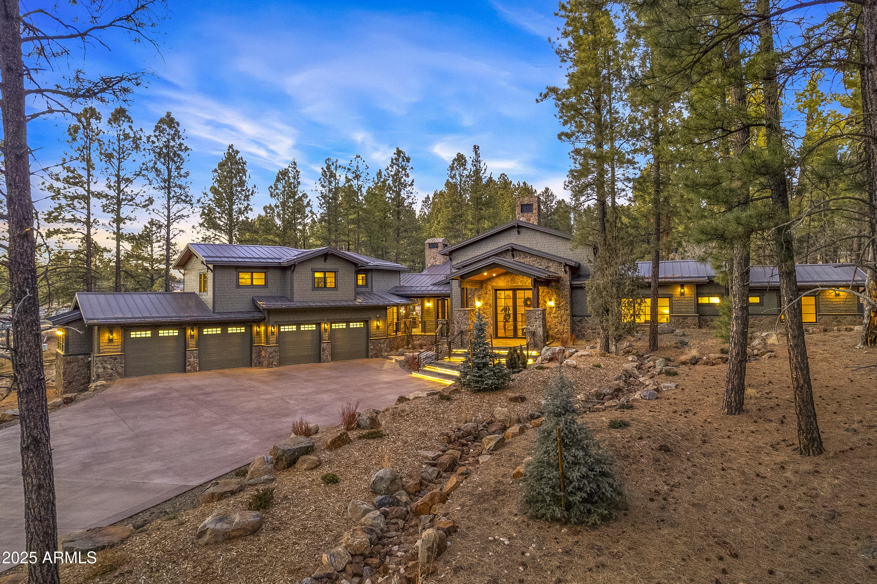 Nestled beside Flagstaff's last perennial spring, the Ciénaga House is a 5,734 sq. ft. retreat with 5 beds, 7 baths, including a 1-bed, 1-bath guest house on 2.21 acres. This estate offers direct access to the Flagstaff Urban Trail, leading downtown or to endless hiking. Snowbowl Ski Resort and Downtown Flag are just minutes away! Designed for elegance and comfort, this home features 6 fireplaces, a stunning great room (with statement limestone fireplace), and an outdoor entertainment area with, heaters, fireplace, and built-in BBQ. The chef's kitchen has Brazilian Soapstone counters, rift-cut oak cabinets, high-end appliances, and a butler's pantry. The primary suite gives a spa experience, steam shower, and private patio. Priced FULLY furnished by Arhaus. Nestled beside Flagstaff's last perennial spring, the Ciénaga House is a 5,734 sq. ft. retreat with 5 beds, 7 baths, including a 1-bed, 1-bath guest house on 2.21 acres. This estate offers direct access to the Flagstaff Urban Trail, leading downtown or to endless hiking. Snowbowl Ski Resort and Downtown Flag are just minutes away! Designed for elegance and comfort, this home features 6 fireplaces, a stunning great room (with statement limestone fireplace), and an outdoor entertainment area with, heaters, fireplace, and built-in BBQ. The chef's kitchen has Brazilian Soapstone counters, rift-cut oak cabinets, high-end appliances, and a butler's pantry. The primary suite gives a spa experience, steam shower, and private patio. Priced FULLY furnished by Arhaus.
