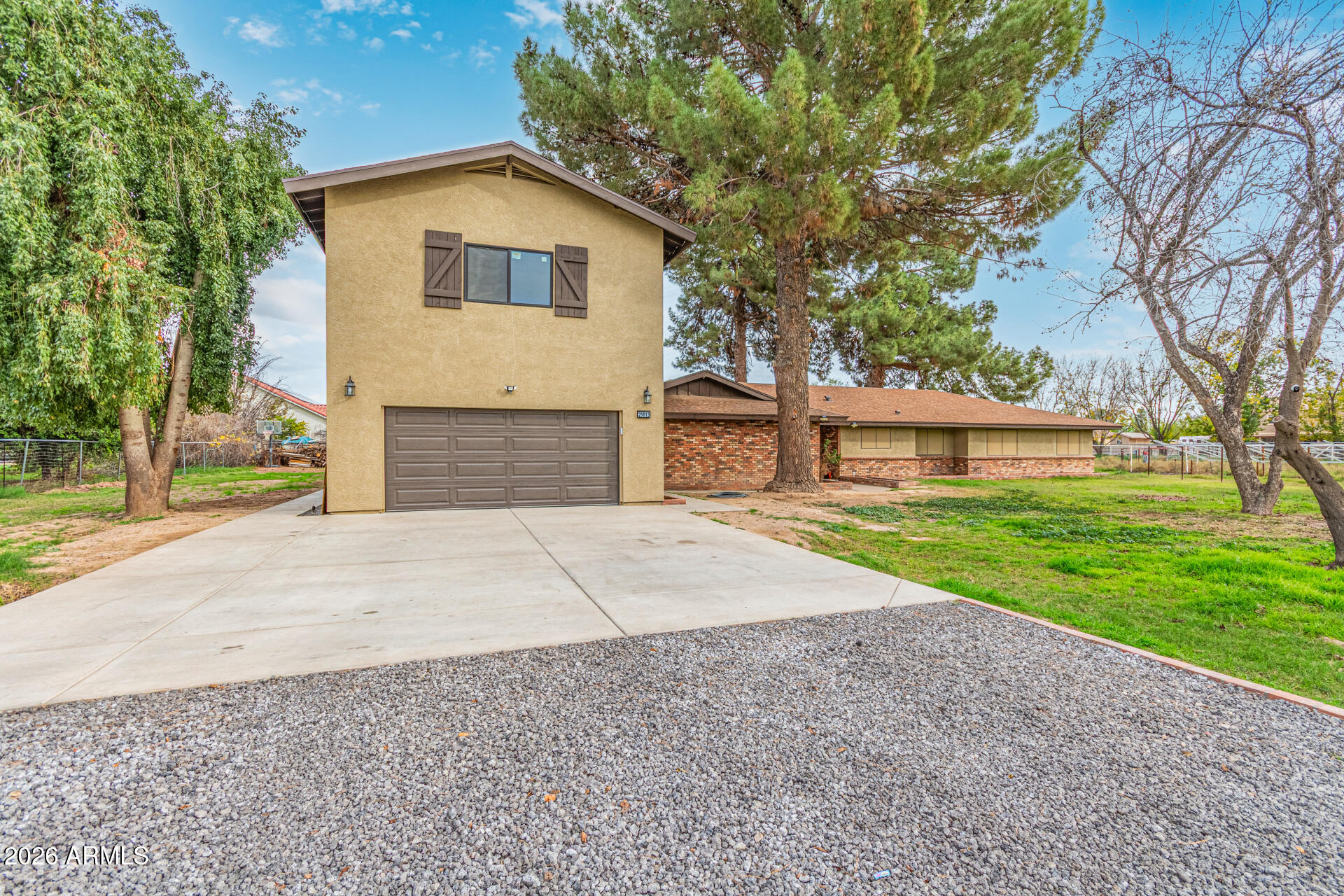 This newly expanded county island estate sits on a full one-acre horse property and offers a rare combination of space, flexibility, and recent high-quality improvements. The home now totals approximately 5,700 sq ft of living space, plus a 900 sq ft garage, following a 3,200 sq ft addition that received final county approval last month. The original portion of the home features 4 bedrooms and 2 bathrooms and offers exceptional living space with two separate family rooms, including one highlighted by large vaulted ceilings and a cozy fireplace. This area has been thoughtfully updated with a brand-new kitchen, new flooring in most rooms, and a new water heater. The home has also been re-insulated in both the roof and walls, fully stucco and painted, and outfitted with window screens throughoutenhancing comfort and efficiency. The newly constructed section offers 2 bedrooms and 2 full bathrooms and was designed with both function and style in mind. This addition includes a generously sized family room, ideal for gatherings or everyday living, along with a large kitchen featuring modern finishes and contemporary touches. Built with 2x6 construction, full spray-foam insulation, and individual mini-split systems in every room, the new section delivers outstanding energy efficiency and year-round comfort. A larger garage and a well-designed next-gen or mother-in-law suite layout provide privacy and flexibility for multi-generational living, guests, or rental potential. With 6 bedrooms and 4 bathrooms total, expansive living areas, modern systems, and a true acre of land with horse privileges, this property combines the freedom of county island living with substantial recent upgradesmaking it a standout opportunity for those seeking space, versatility, and long-term value.sc