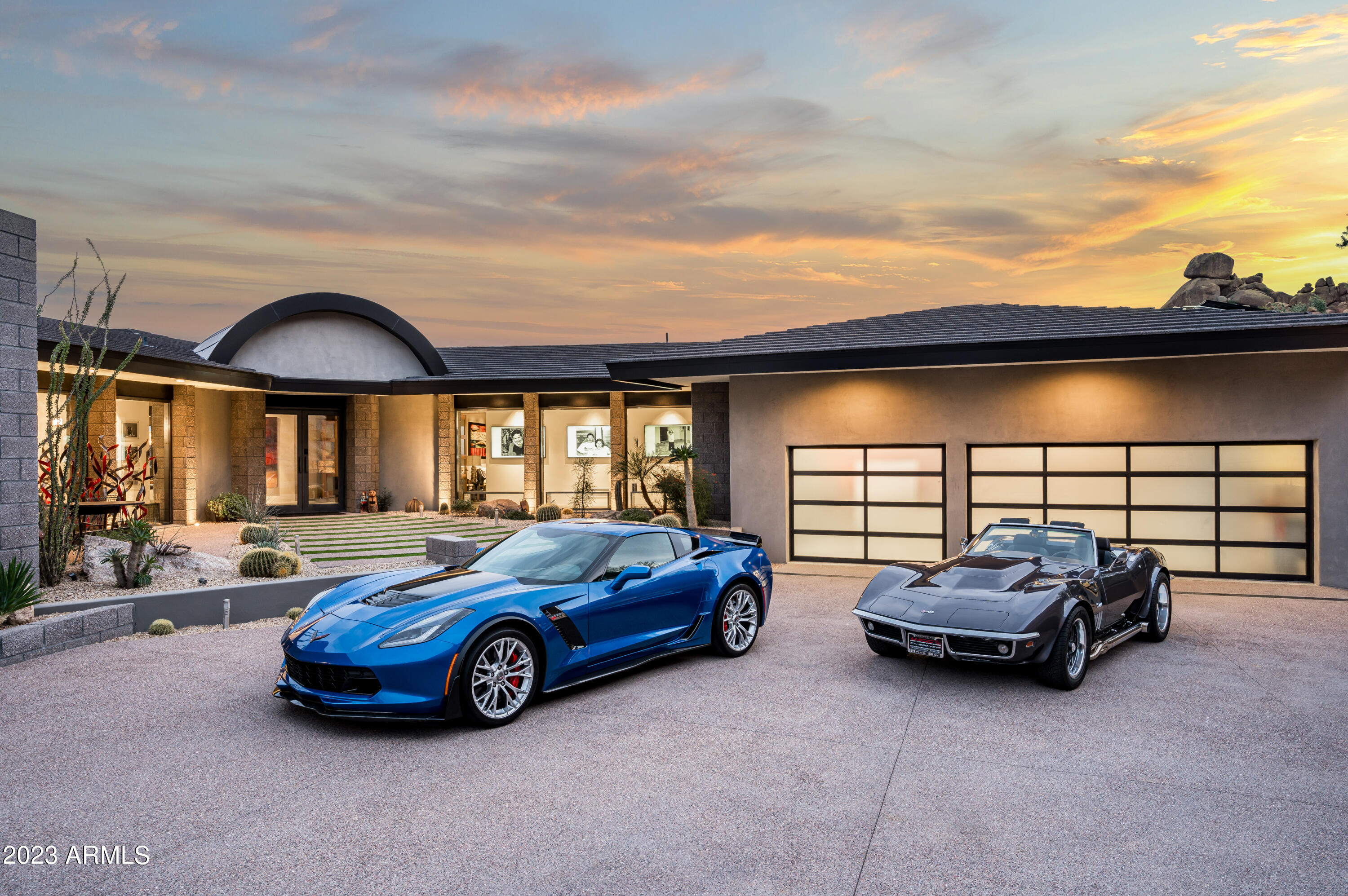 Welcome to this stunning property! With unsurpassed architecture and design, this house offers a unique blend of elegance and contemporary living. Perched high on Black Mountain in Carefree AZ, it provides breathtaking views of the mountains and city lights. Formerly owned by Jack Parker, the CEO of GE, this home has been beautifully reimagined for today's homeowner. As you step inside, you'll be captivated by the complete floor-to-ceiling remodel that showcases a Frank Lloyd Wright style contemporary aesthetic. Every detail has been carefully considered to create a harmonious living space. With four bedrooms and four and a half bathrooms, there is ample room for the whole family to enjoy. The property boasts not one, but two full master bathrooms with large showers that are even plumbed for a steam room experience. Additionally, there are two walk-in closets and two laundry rooms for added convenience. 
The expansive 5400 square feet of living space allows for comfortable and luxurious living. The interior is flooded with natural light thanks to the floor-to-ceiling windows covered with energy-efficient Intellifilm. You'll appreciate the all-new LED lighting throughout the home, providing a warm and inviting atmosphere.
This property is a dream come true for those who love to entertain. The spacious kitchen has top-of-the-line appliances and plenty of counter space for meal preparation. The kitchen includes all Miele appliances: 48" 6 burners + griddle cooktop with double oven, 60" side-by-side refrigerator, and freezer, steam oven, microwave, & an espresso machine. Host unforgettable gatherings in the open-concept living area, or take the party outside to enjoy the outdoor kitchen & gas fire pits. The outdoor kitchen includes a 30" EVO wok/griddle, wood/gas-fired Chicago Brick Pizza Oven, and a Traeger Pellet grill/smoker.
Car enthusiasts will be delighted by the seven-plus car garage spaces and multiple 50 and 30-amp outlets. The property also features an electric car charger, perfect for eco-conscious individuals. With all-new electric and plumbing systems and three new HVAC systems with efficient subterranean returns, you can enjoy peace of mind knowing that this home has been meticulously updated.
One of the standout features of this property is the impressive $100,000 SolarCity/Tesla 30kW solar system. Not only does it provide environmentally friendly energy, but it is also fully paid for, offering significant savings for the future owner. The attention to detail extends beyond the interior of this home. Custom-made all-steel doors, windows, and patio trellis cover add a touch of sophistication to the exterior. You'll also find a generator on-site, ensuring you always have power.
Located in Carefree, AZ, this property offers a tranquil escape from the hustle and bustle of the city while still being within reach of modern amenities. Enjoy the serenity of the surrounding desert landscape in your outdoor sauna while just a drive away from shopping, dining, and entertainment options. Outdoor entertainment includes multiple patio seating areas, a new pool with an electric heater, a waterfall, and in-floor cleaning: an eight-person Hot Tub and a large sauna.
Take advantage of your opportunity to own this extraordinary home that seamlessly blends timeless design with modern comforts. Contact us today to see it in person and experience this property's beauty and elegance.