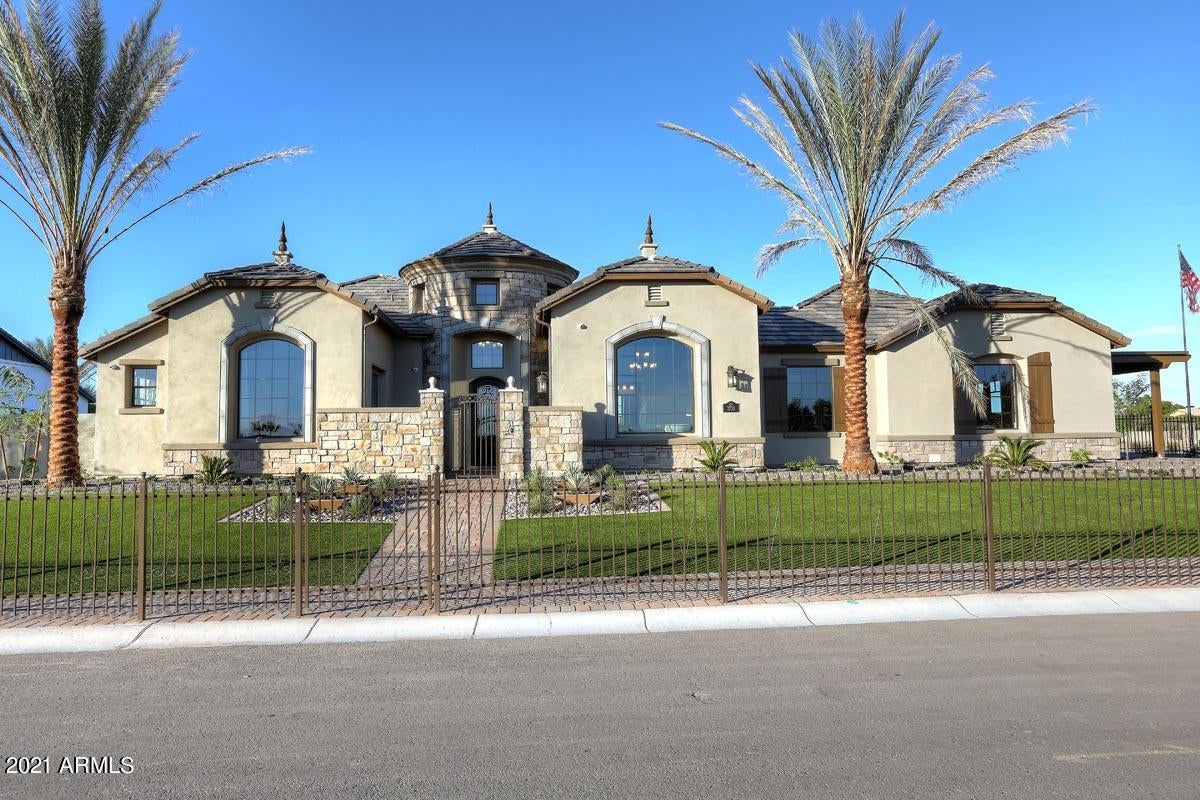 Gorgeous Brand New Home that is Under construction now at Framing. Huge lot on over 1/2 acre at 29,000 sq ft with mature citrus trees on the lot for total privacy. This home is a Residence 8 floor plan and a French Cottage Elevation opening up right onto the community park super unique lot as it is it's own island within the neighborhood. Huge open great room with double islands to dream for!  5 bedrooms with 5.5 bathrooms all on one level. The Charm, Space and Privacy is untouchable in the Valley.  PHOTOS ARE OF THE MODEL. Final Price will change once buyer selects finishes/upgrades.  Buyer can still flooring and countertops. No front yard and no backyard is included. Buyer can add on a pool and final price will go up. APN is master APN until individual parcel numbers are set.