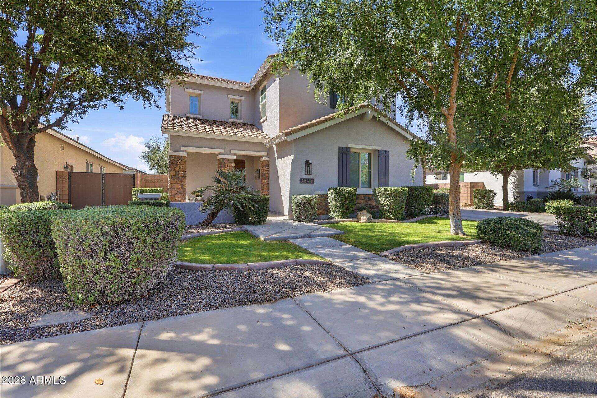 Welcome to Freeman Farms!! With 4,710 square feet of beautifully designed living space, this home combines comfort, functionality along with 2 primary suites to accommodate multi generational living or guests!. This home has one brand new AC and one that is a couple years old with transferable warranties.  Step inside to find spacious open-concept living areas filled with natural light, elegant finishes, and seamless indoor-outdoor flow. The chef's kitchen opens to generous dining and living spaces--perfect for entertaining or everyday living. Large sliding glass doors lead to a private backyard retreat, ideal for relaxing or a side patio for more intimate gatherings. With seven true / spacious bedrooms, including, multiple walk in closets, and flex spaces, there is room for everyone! The shaded backyard is  so nice along with the covered patio! Located in the desirable Freeman Farms community, residents enjoy access to HUGE grassy parks, scenic walking paths, basketball courts, a beautiful lake, and more--creating a vibrant, outdoor-friendly lifestyle.  Gilbert Regional Park is just across the canal for sports, fishing and frequent entertainment! This is a rare opportunity to own a spacious, move-in-ready home in one of Gilbert's premier neighborhoods!