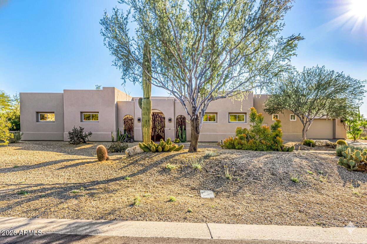 A rare convergence of privacy, scale, and utility. This meticulously maintained, single-owner estate encompasses nearly 4,000 square feet of high-volume living space, situated on a 1.2-acre lot within a private gated enclave. Designed with an emphasis on architectural longevity, this residence offers a sophisticated foundation for a custom modern refresh.

For the automotive enthusiast or hobbyist, the property features an expansive oversized garage that serves as a true center-point. With a 12'-6'' ceiling height, the space is engineered to accommodate lifts, high-profile vehicle storage, or a professional-grade workshop--a feature rarely found in standard luxury builds.

An open-concept floor plan characterized by soaring ceilings and a seamless flow between social and private zones. Primary bedroom includes a massive walk-in closet and a spa-scale bathroom, offering a footprint ready for a designer transformation.

The Location: Enjoy the seclusion of a quiet desert sanctuary without sacrificing connectivity. Positioned minutes from North Scottsdale's premier dining, retail, and commercial hubs, this property represents a strategic land holding in one of the valley's most desirable corridors.