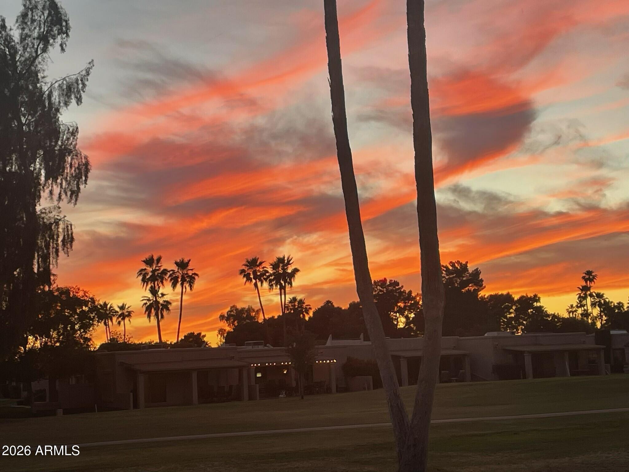 Priced a bit higher than the rest, but one of the best!!  Fountain of the Sun, active adult, Golf Community! This golf view 2 bed/2 bath condo is also a great lock & leave escape (HOA fees cover a lot!)  Enjoy making a meal in the cute kitchen w/ample, newer countertops.  The sit up counter allows you to serve your guests buffet style & be a part of the action in the great room or just simply enjoy the view thru the sliding glass doors.  Pamper yourself in the spacious main bedroom w/updated ensuite bath.  Guests will enjoy the split 2nd bedroom & bath or you can make it a great office/den for your personal use. Large covered rear patio w/golf course views serves up beautiful sunsets.  Attached laundry room with storage space is a plus!! Some furnishings may convey.