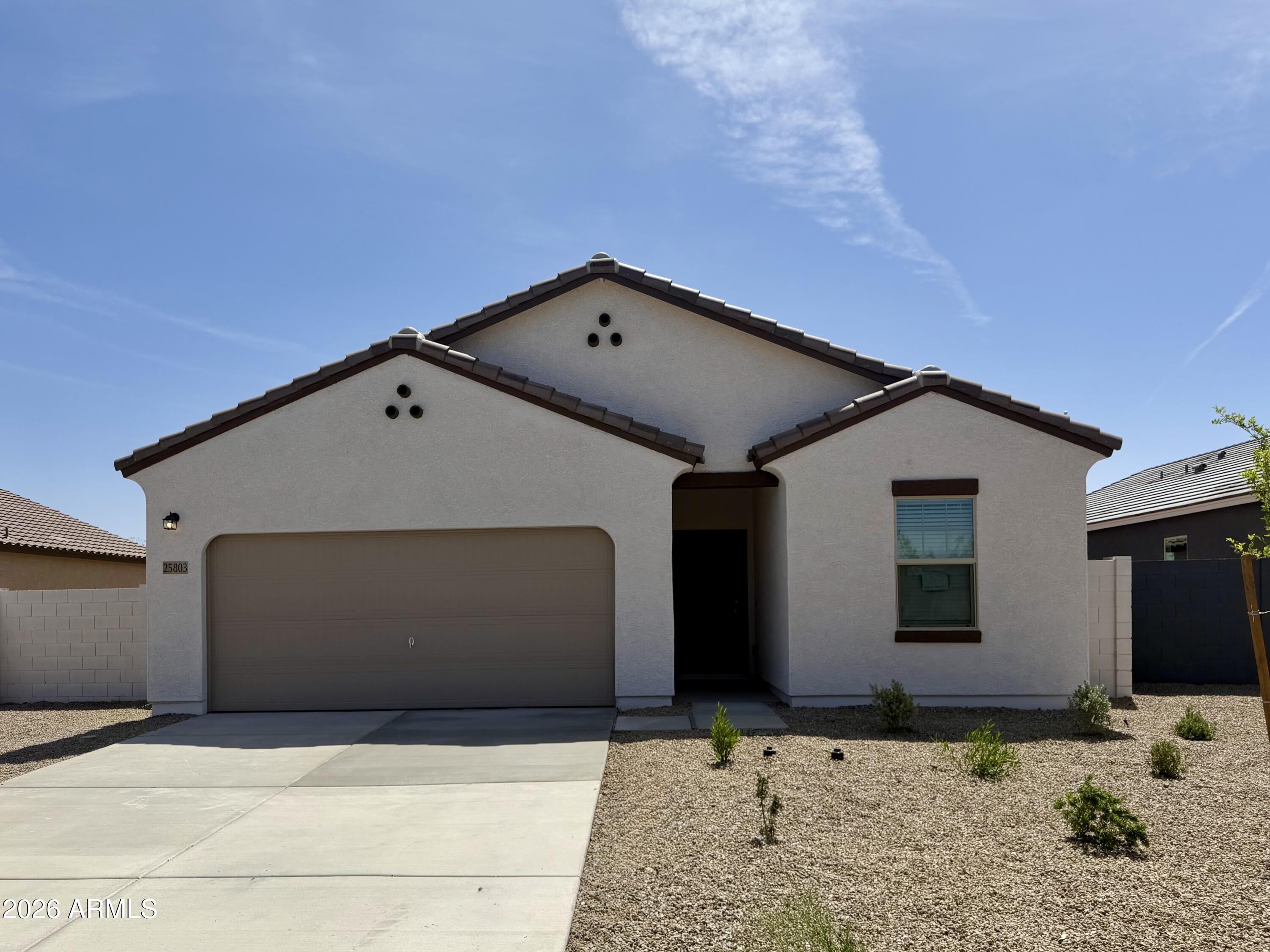 Move-in ready new home on a larger lot with a 15-ft side yard and no rear neighbors, offering scenic desert views! Prime East Valley location near San Tan Valley, Queen Creek, and community amenities. Features include white shaker cabinets, granite countertops, stainless steel appliances, 9' ceilings, and a spacious owner's suite with walk-in closet. Energy-efficient with dual-pane windows and smart thermostats. Includes covered patio, front yard landscaping, and access to parks, trails, shopping, dining, and top-rated schools. Surrounded by the beauty of the Sonoran Desert--Florence is a true hidden gem!